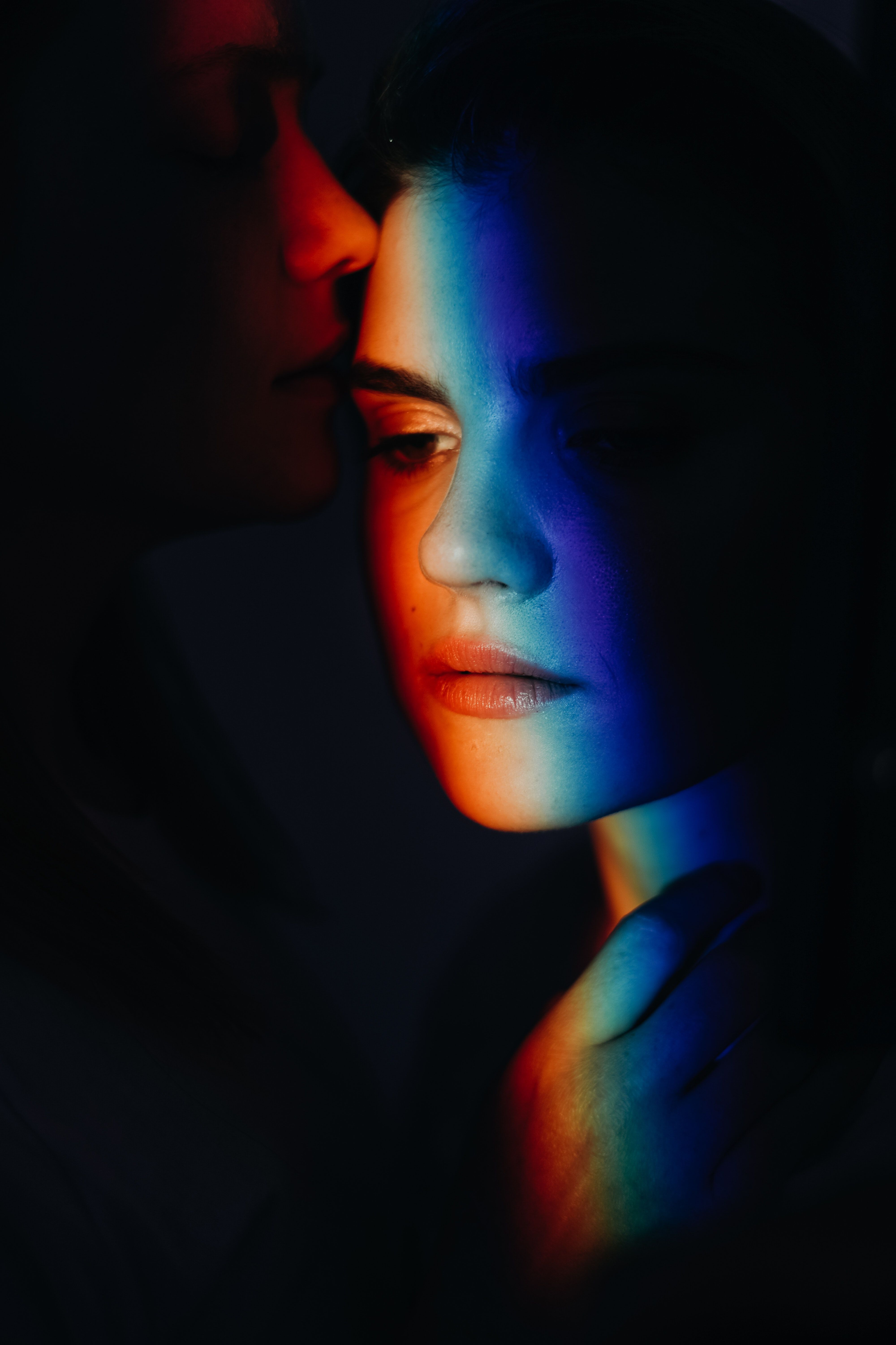 Woman With Rainbow Color Light on Her Face · Free