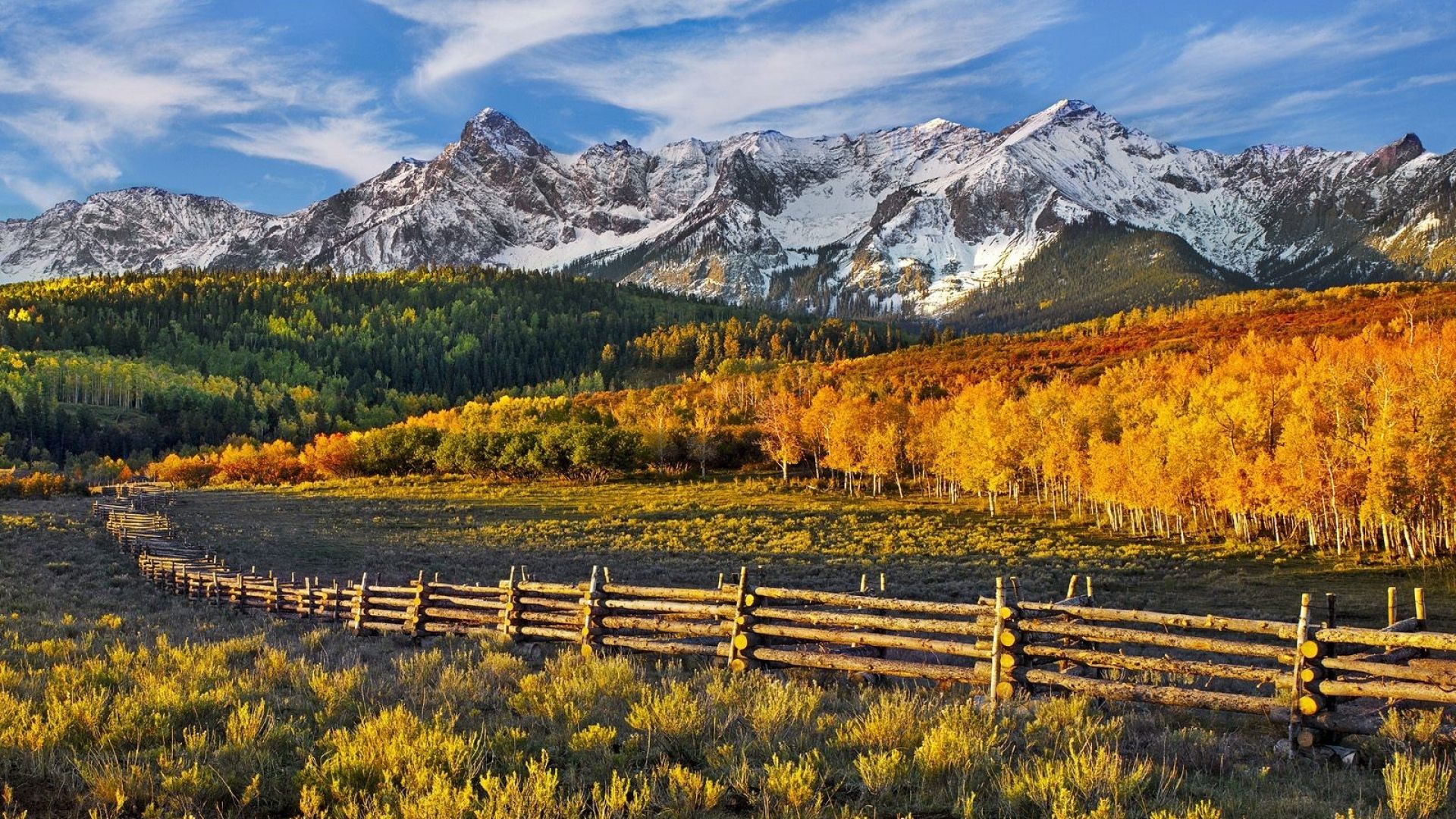 Download Wallpaper 1920x1080 mountains, autumn, fence, logs, pasture, trees Full HD 1080p HD Background