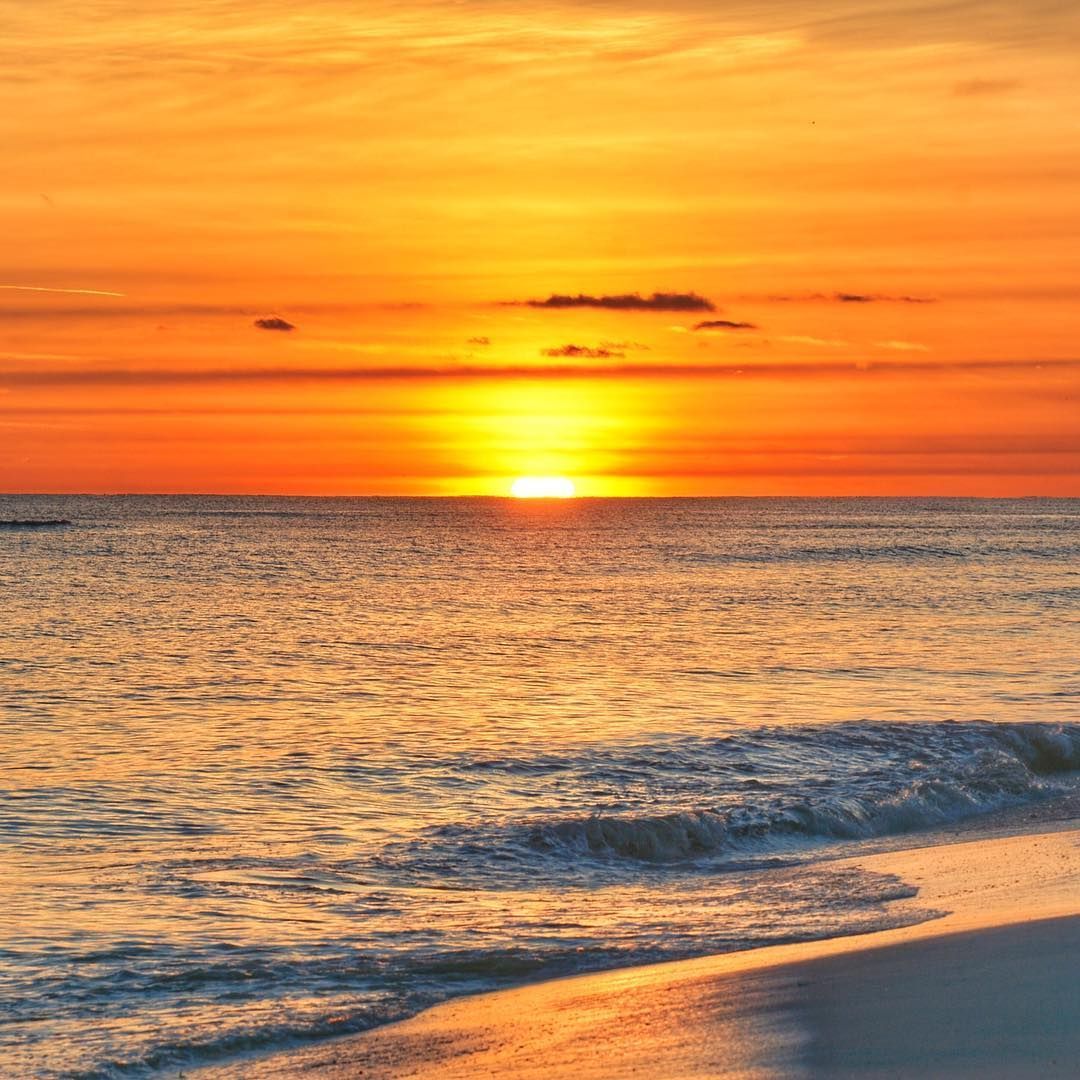 The sun melts into the Gulf at sunset at Pensacola Beach. #ExperiencePcola