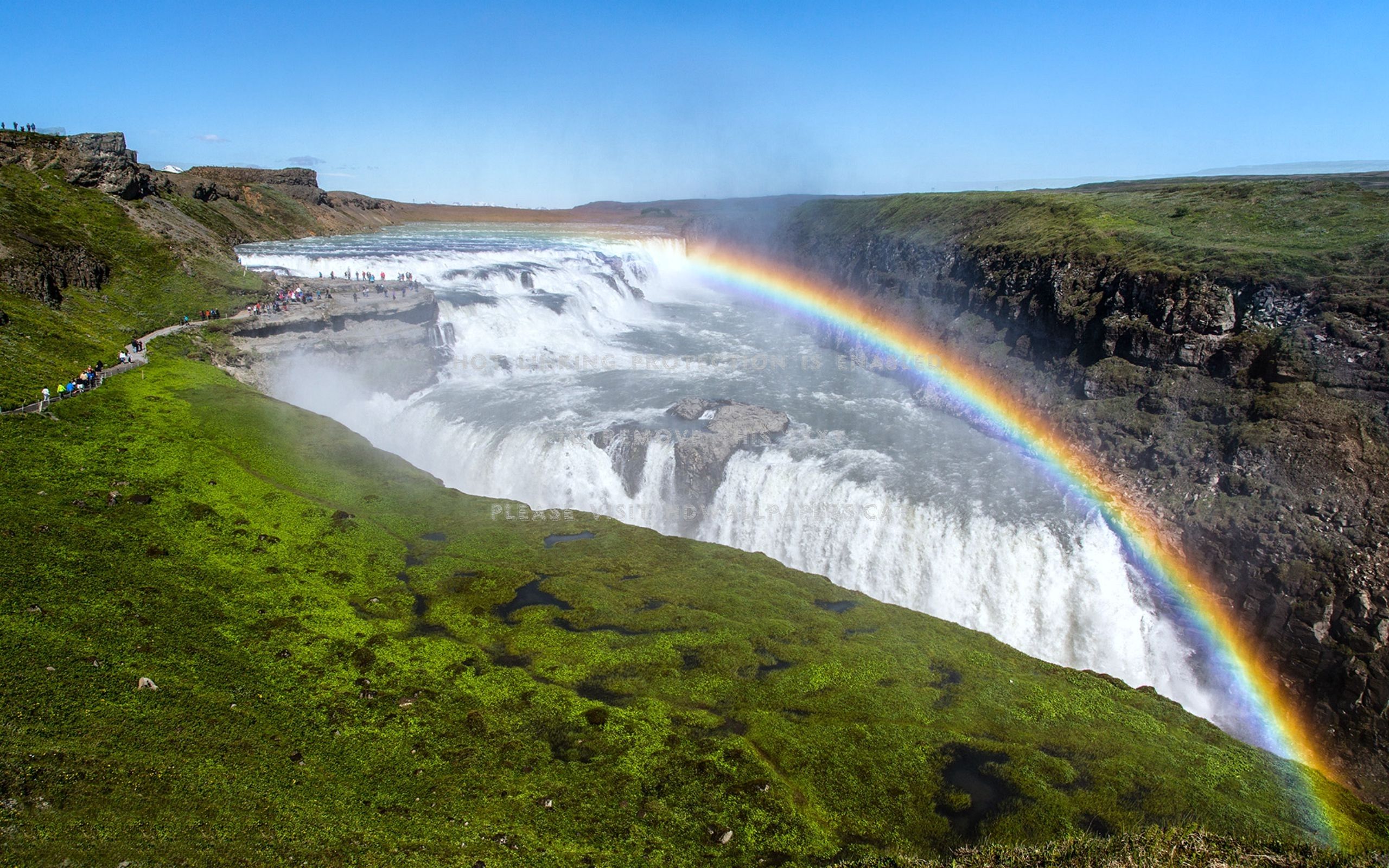 rainbow over gullfoss waterfall iceland