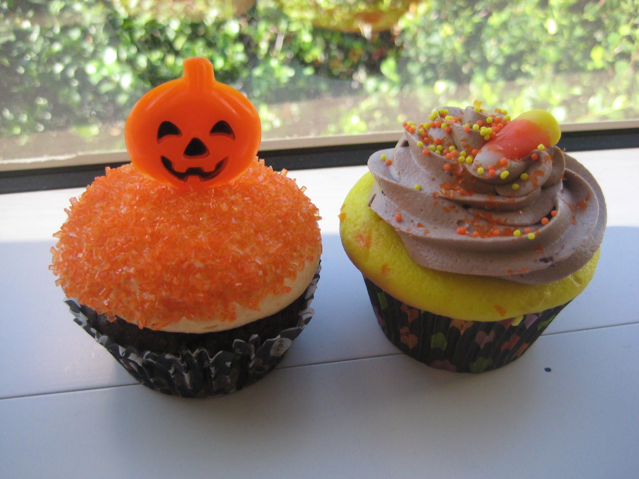 Halloween cupcakes with candy corn and pumpkin