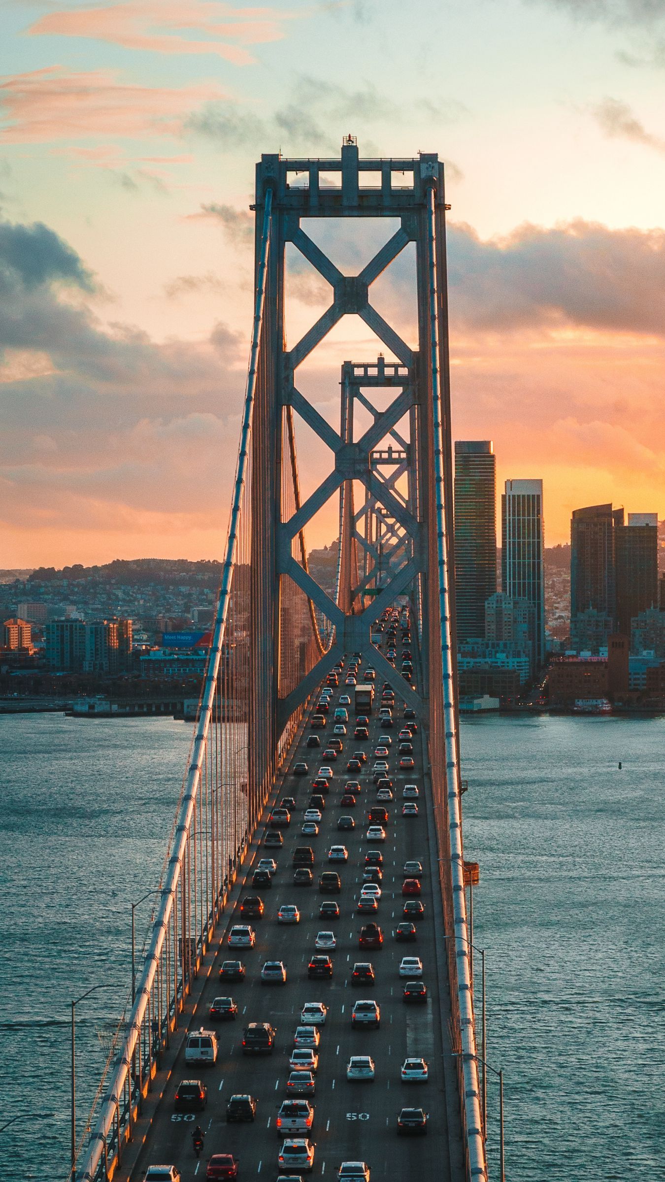 Download wallpaper 1350x2400 bridge, traffic, motion, sunset, city, san francisco, united states iphone 8+/7+/6s+/for parallax HD background