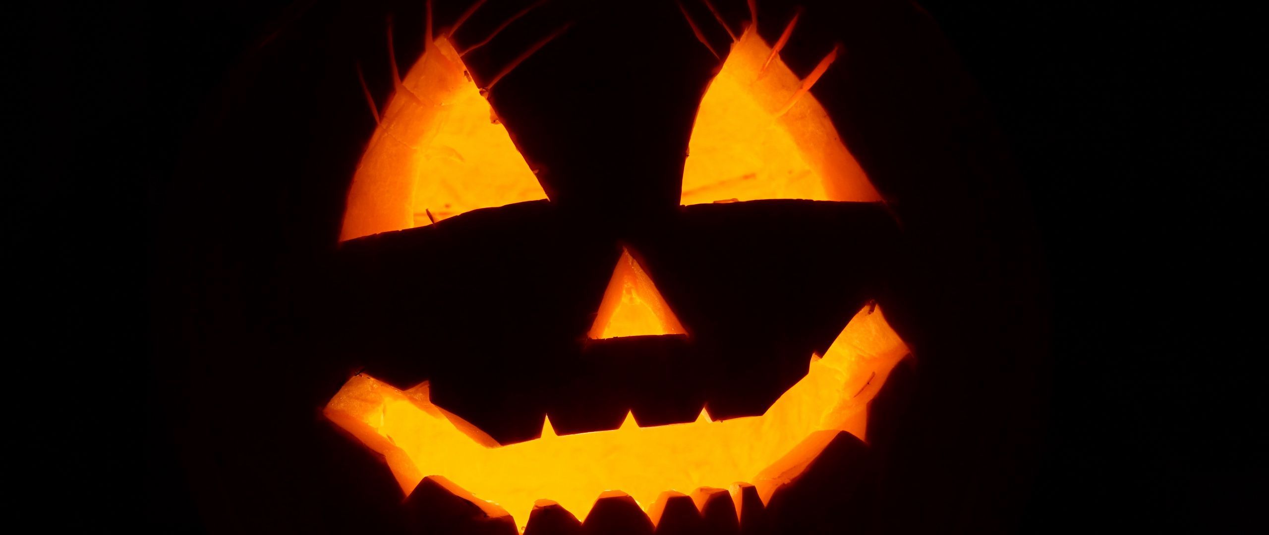 Download wallpaper 2560x1080 halloween, face, black background dual wide 1080p HD background