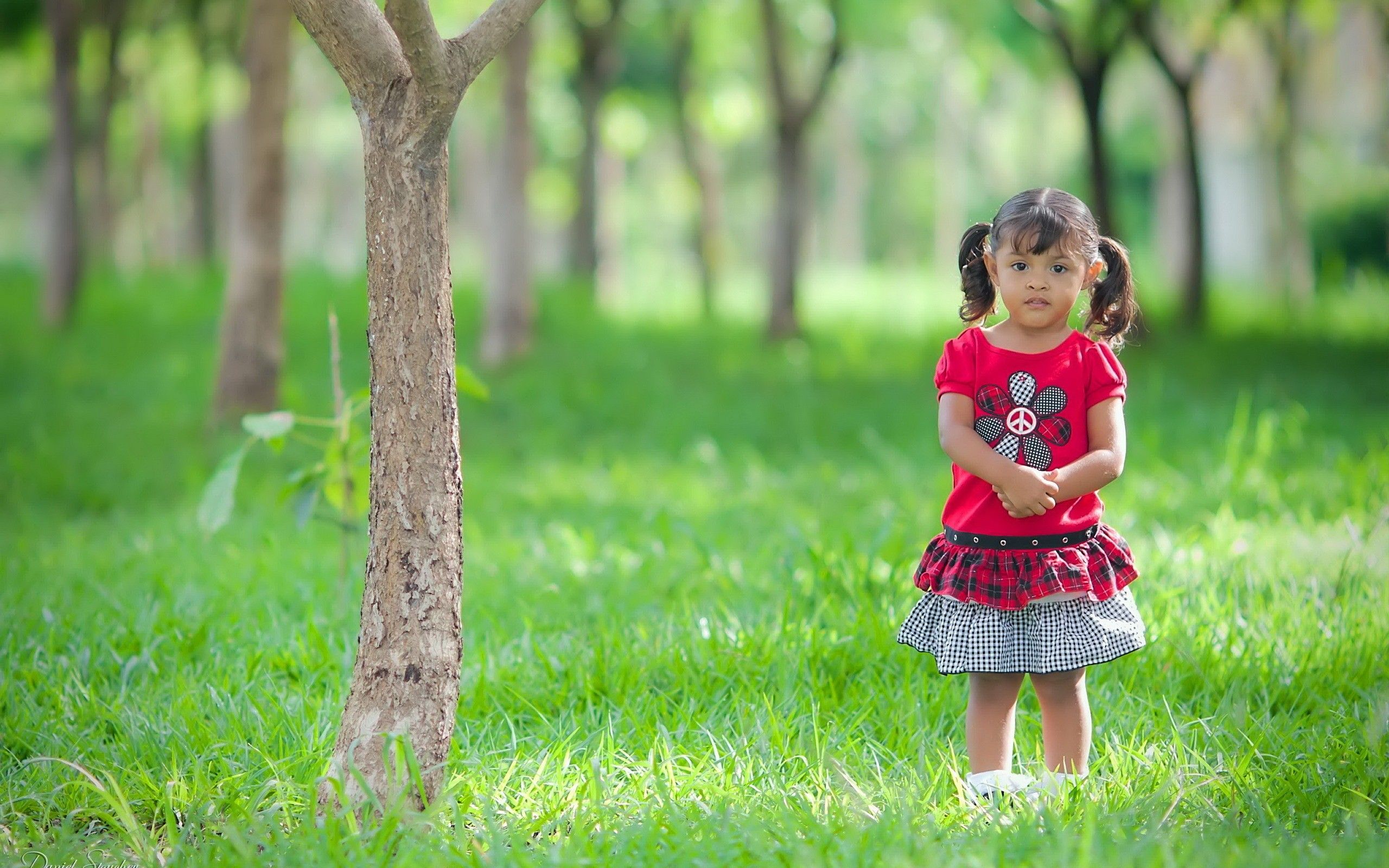 Beautiful Cute Little Girl Child Standing Silently in Garden Photo