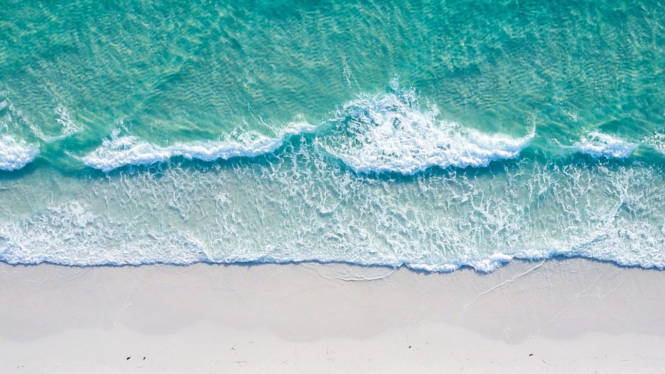 Download wallpaper 1366x768 ocean, coast, aerial view, sand, beach, surf, foam tablet, laptop HD background