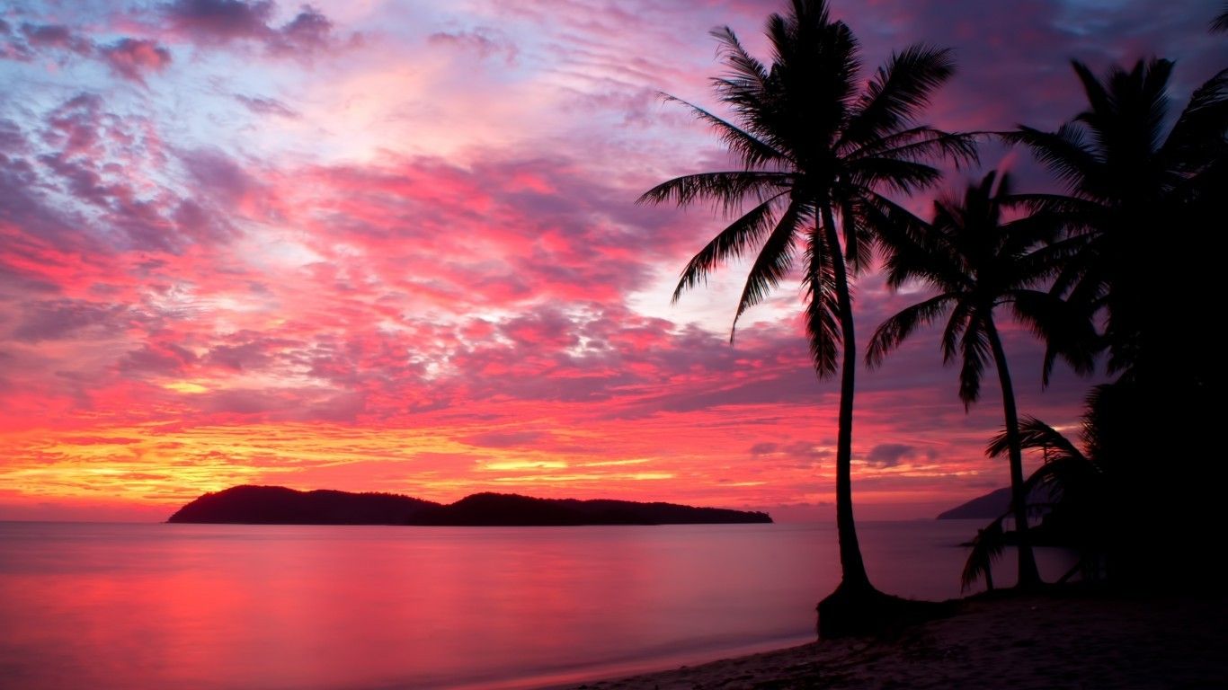 Download 1366x768 Malaysia, Sunset, Beach, Palms, Island, Red Sky, Clouds Wallpaper for Laptop, Notebook