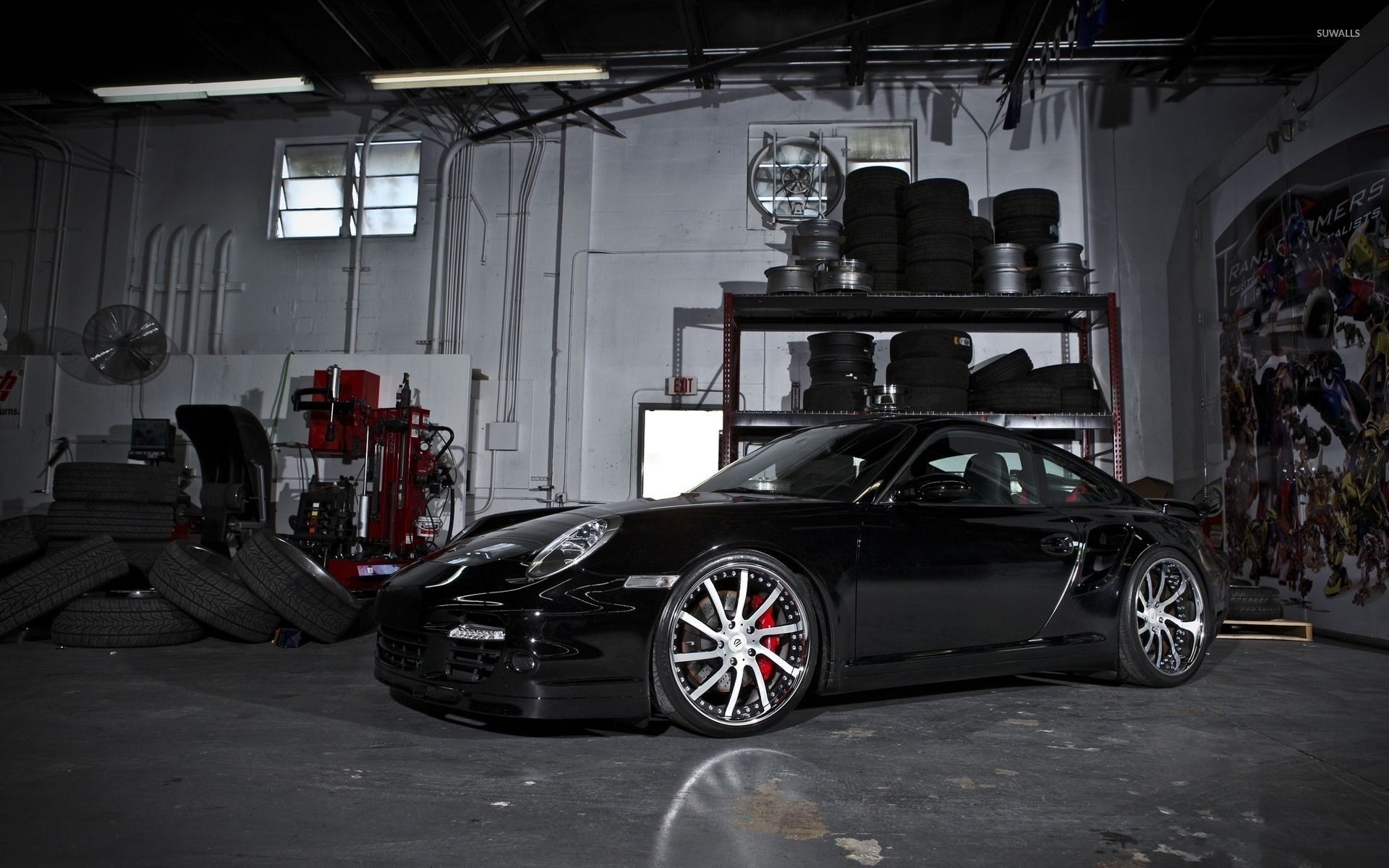 Black 2011 Porsche 911 Carrera in a garage wallpaper wallpaper