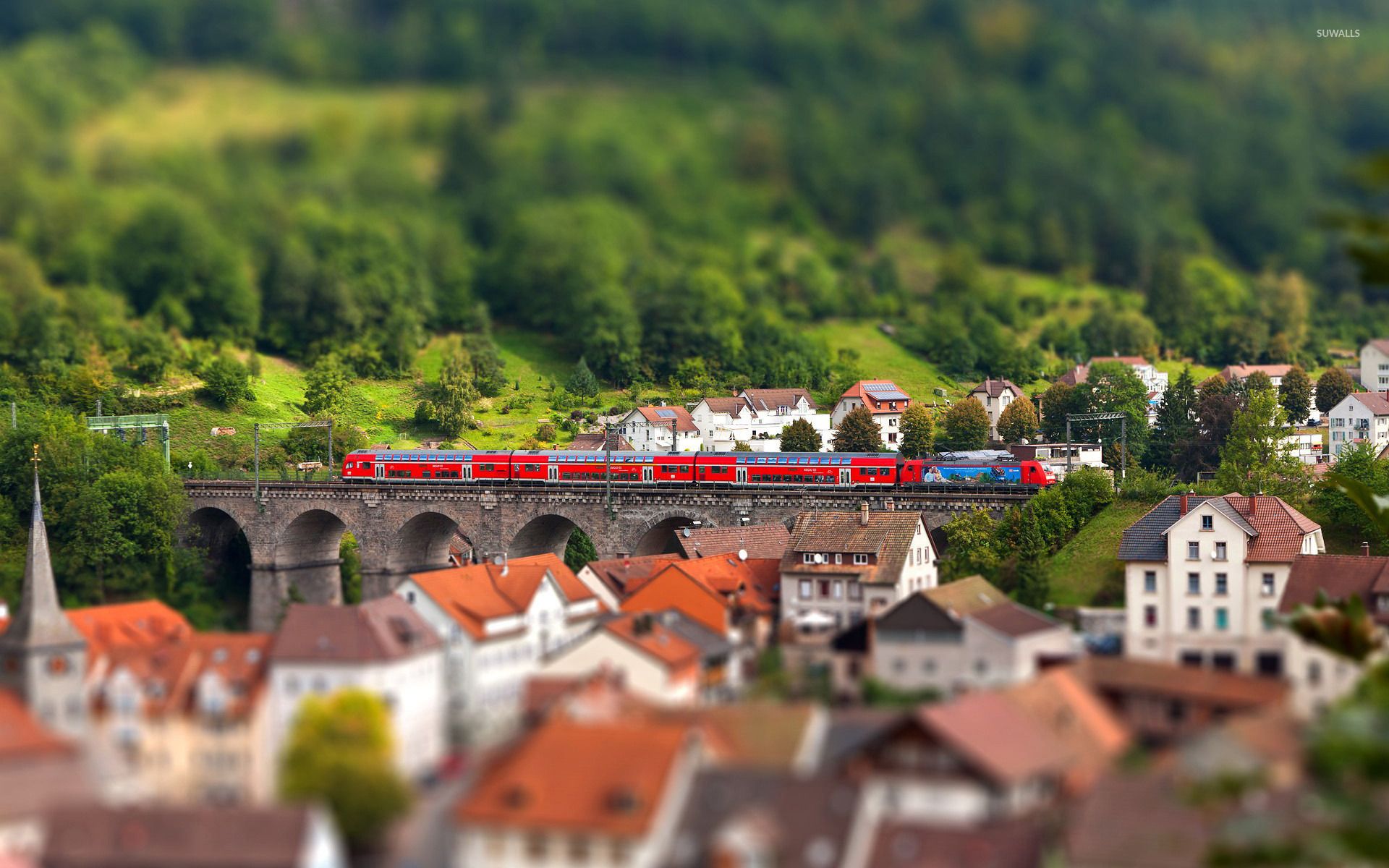 Red train on a stone bridge wallpaper wallpaper