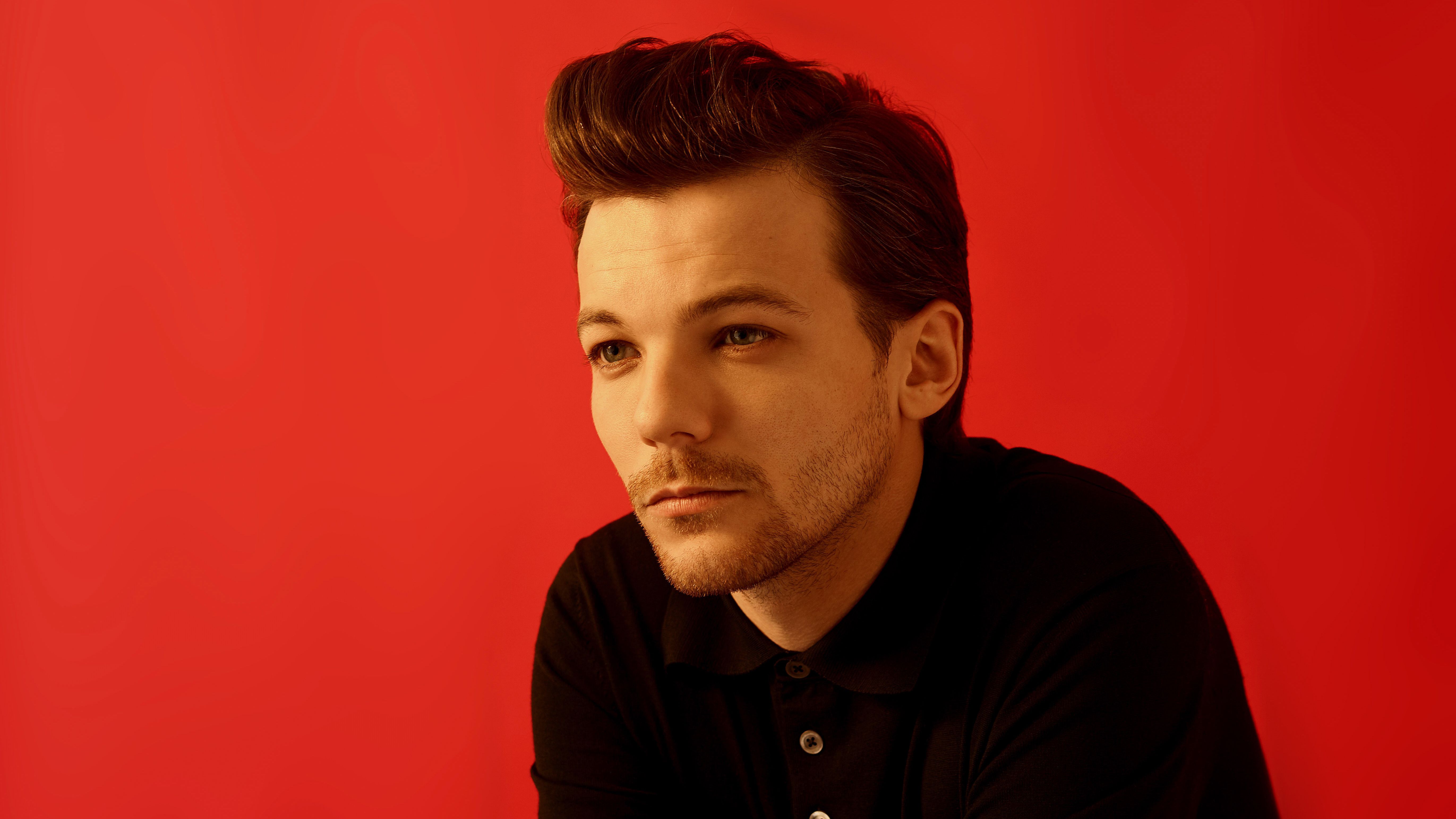 Singer Louis Tomlinson on a red background wallpaper and image, picture, photo