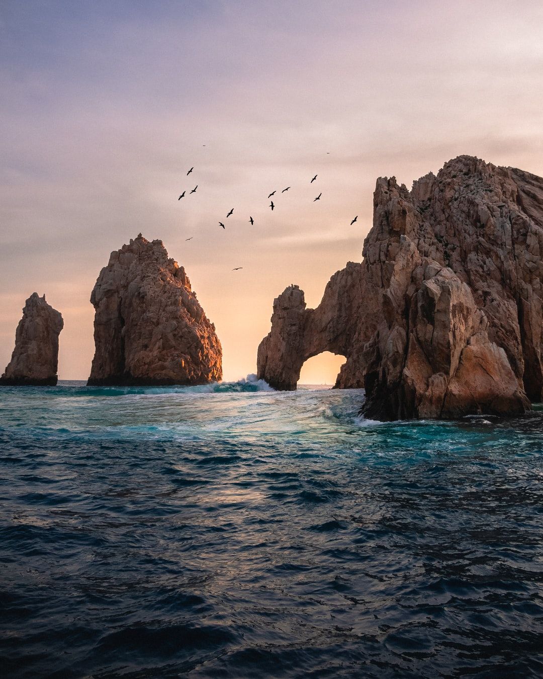 rock formation on the ocean photography photo