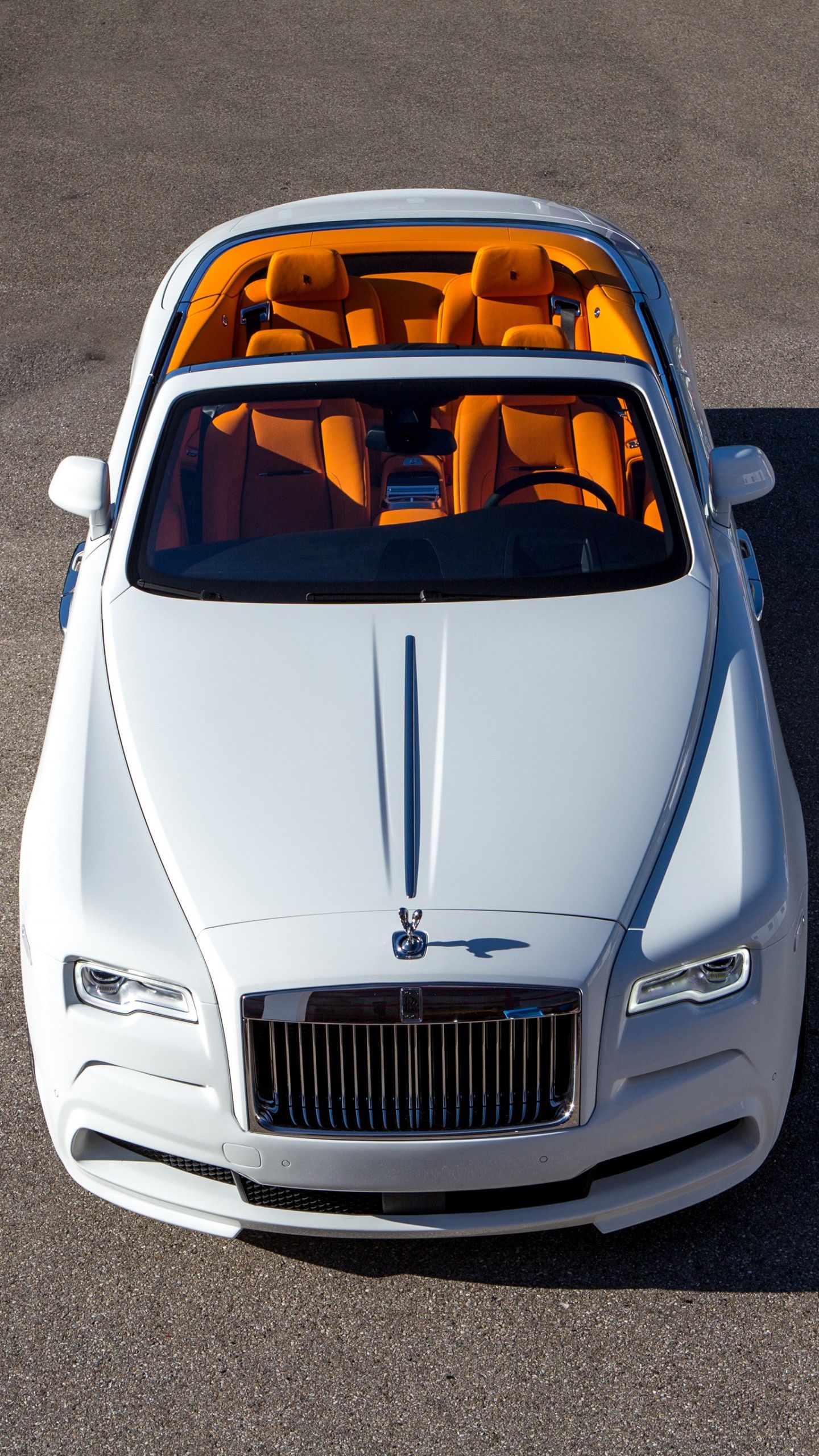 Photo of White RollsRoyce Ghost Parked Near Brown Building  Free Stock  Photo