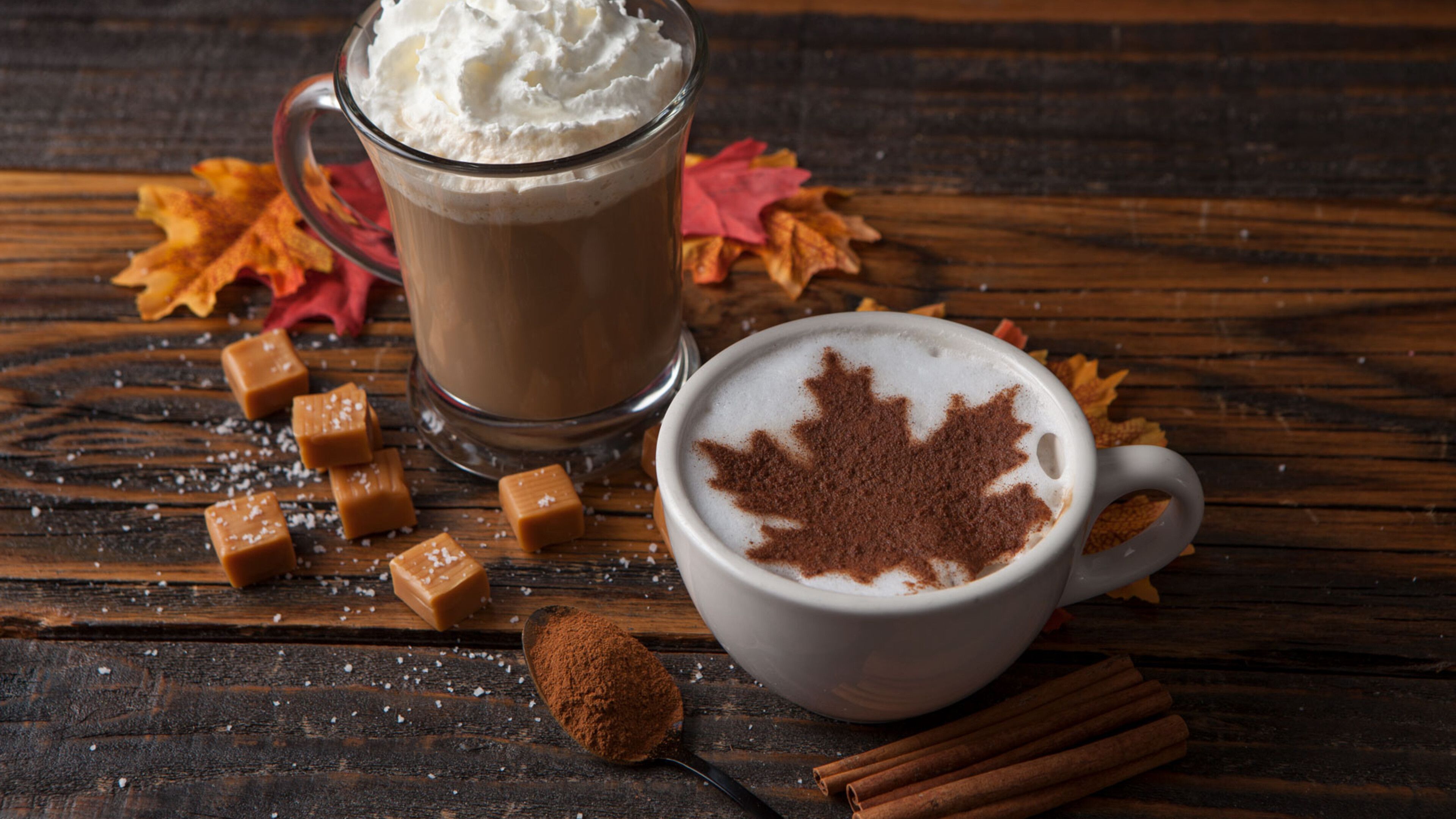 Autumn cinnamon leaf in a cup of hot coffee