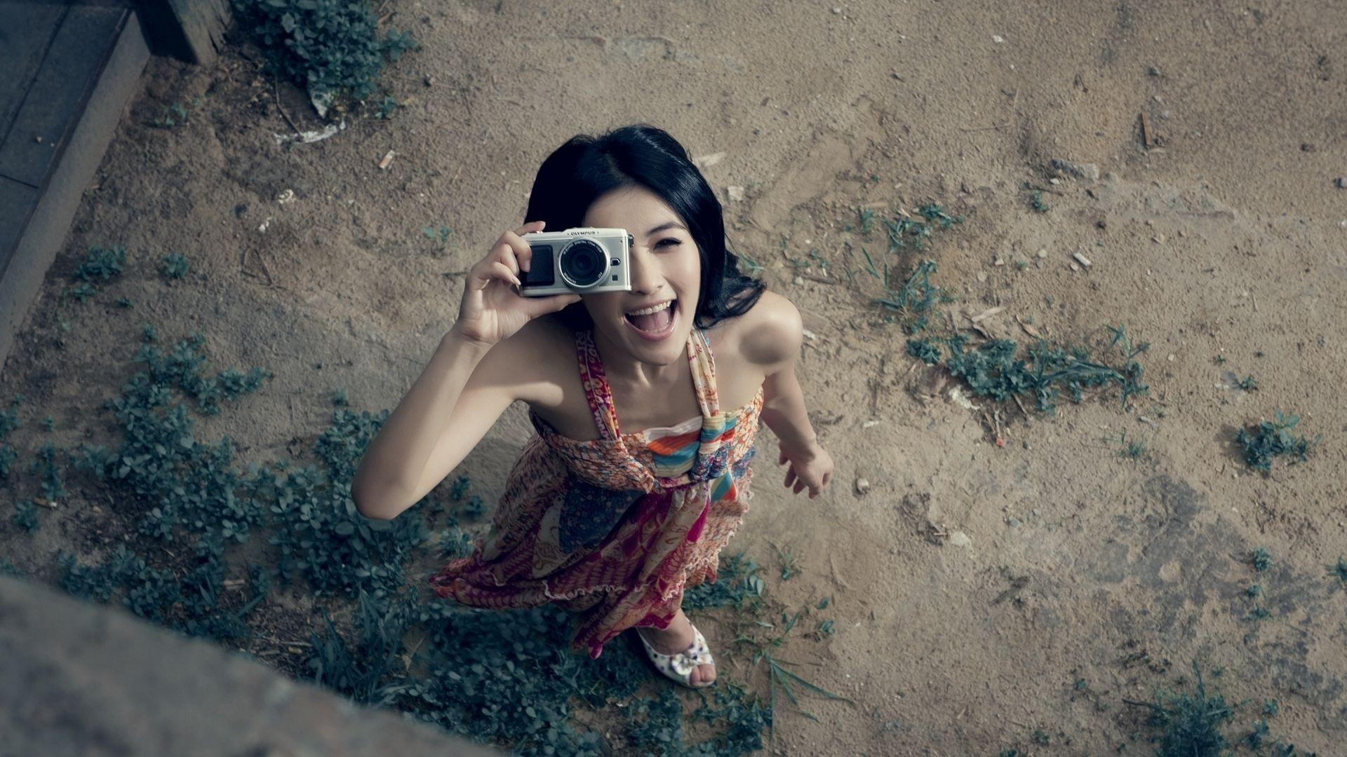 HD Happy girl taking a picture Wallpaper
