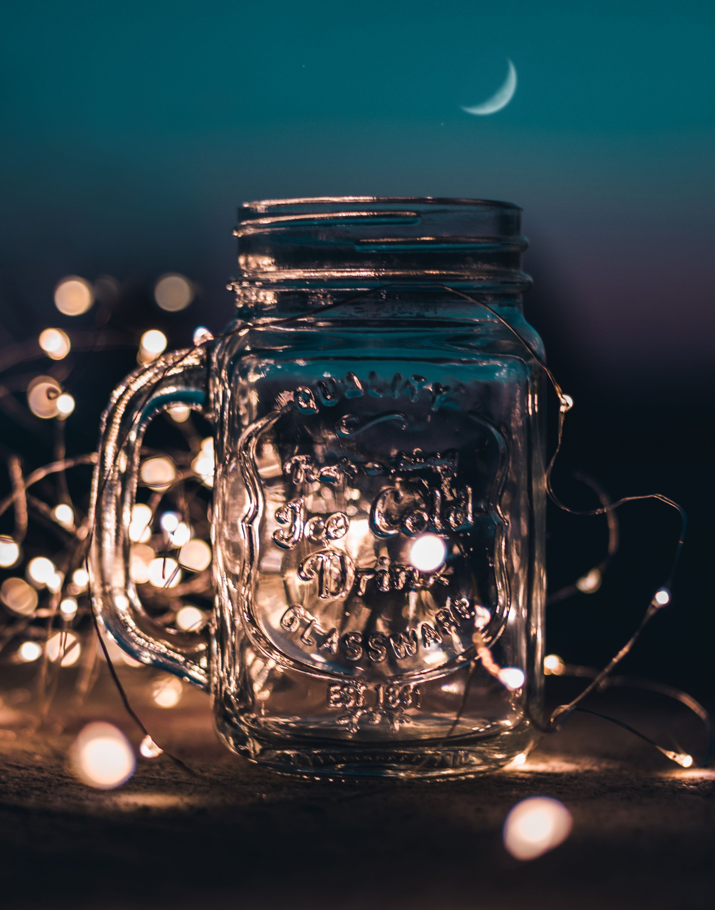 Shallow Focus Photograph of Clear Glass Mason Jar With Fairy Lights · Free