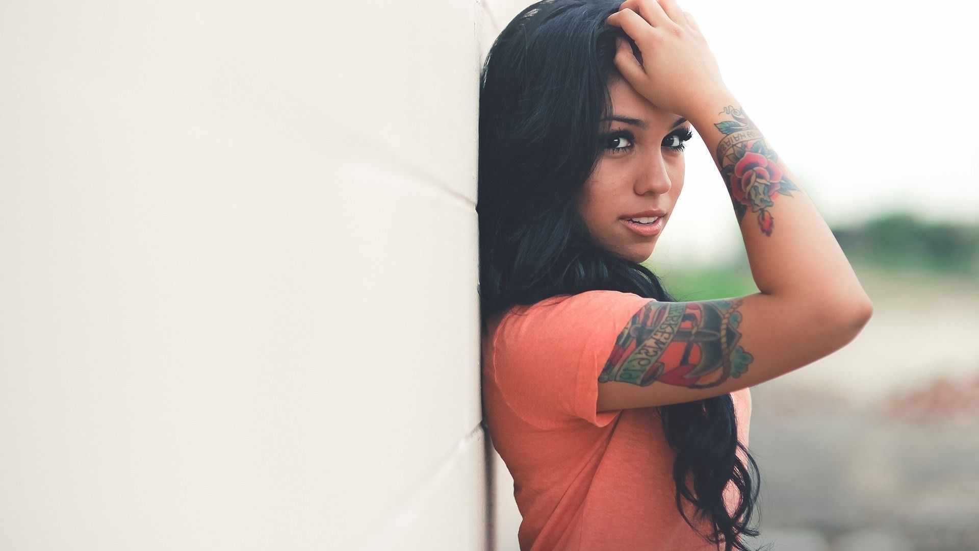 women, Dark Hair, Tattoo, Dark Eyes, Smooth Skin, Against Wall, Orange, Hands On Head Wallpaper HD / Desktop and Mobile Background