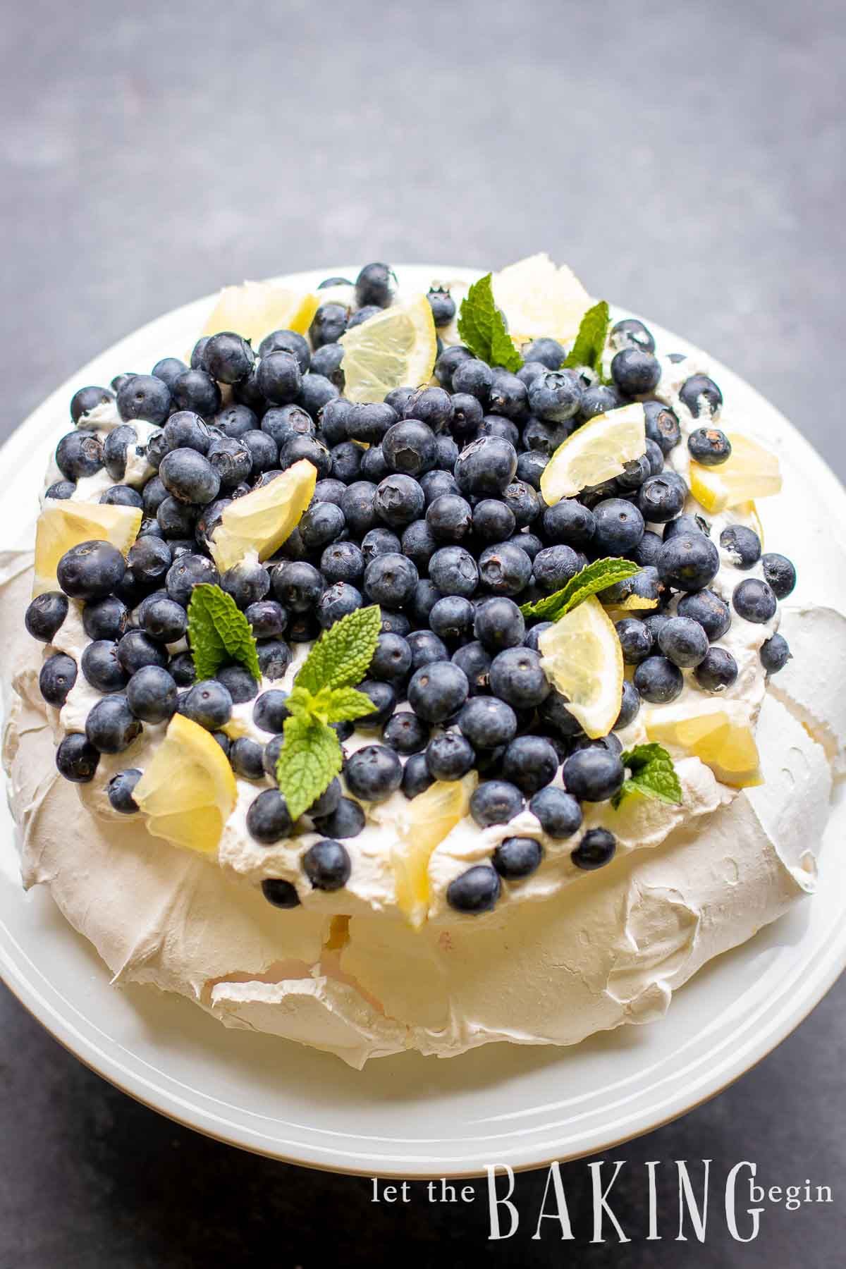Pavlova cake is a stunning dessert that is naturally gluten free and airy. This is the perfect dessert to make when you wan. Pavlova cake, Pavlova recipe, Pavlova