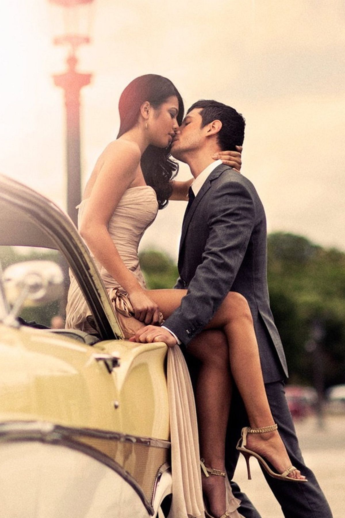 Couple wants to lips kiss at car bonnet mobile wallpaper