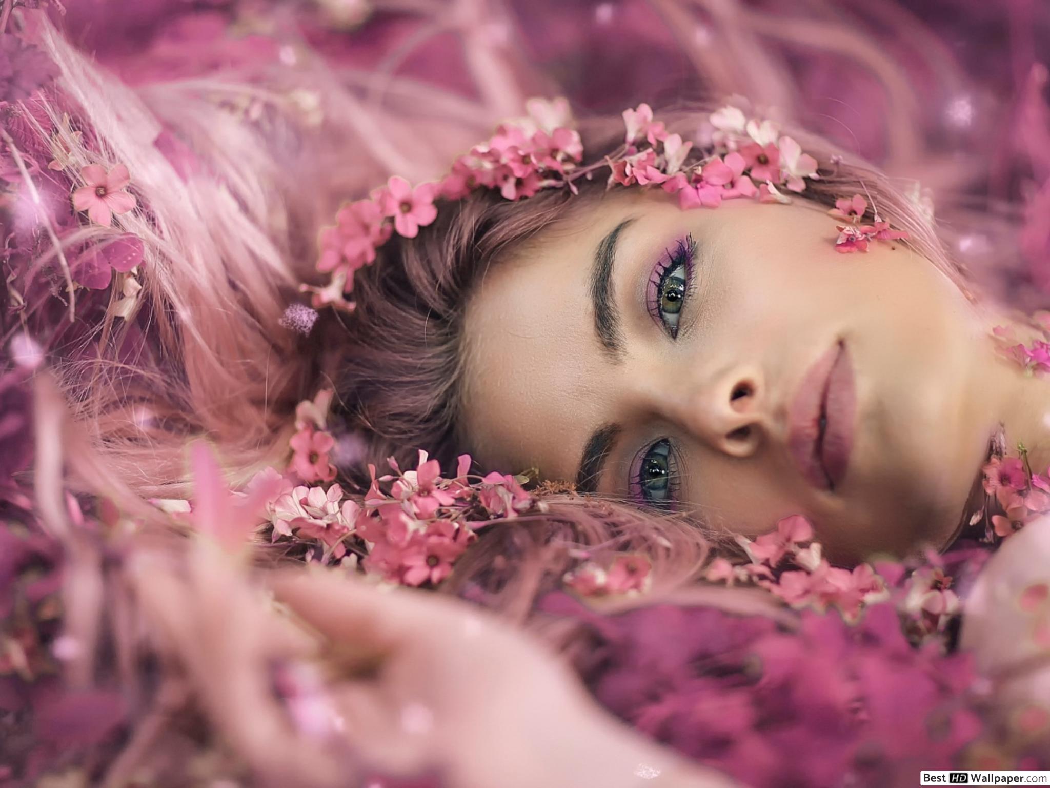 Beautiful girl lying on pink flowers HD wallpaper download