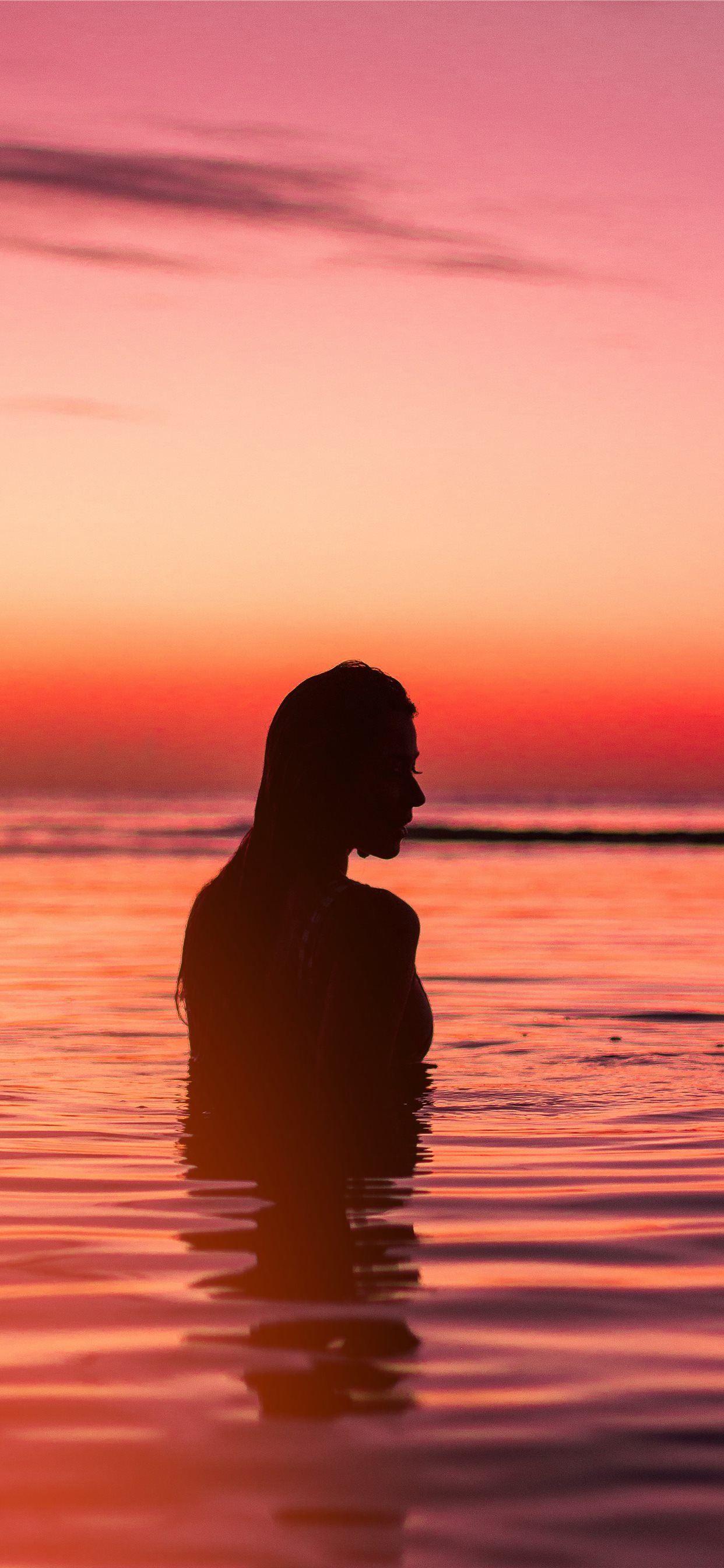 silhouette of woman in body of water iPhone X Wallpaper Free Download