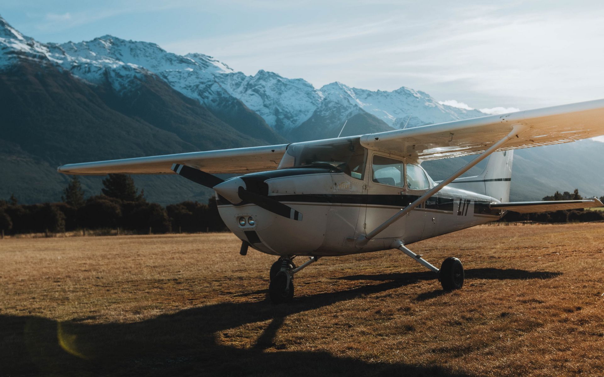 Download wallpaper 1920x1200 airplane, transport, metal, mountains, snowy widescreen 16:10 HD background