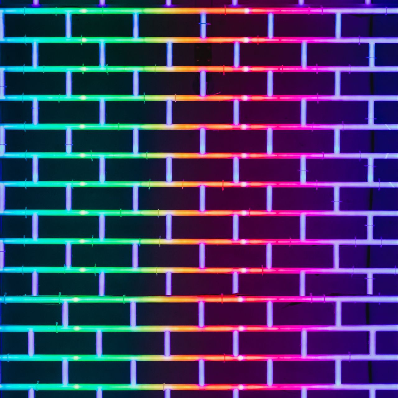 Download wallpaper 1280x1280 wall, brick, neon, glow, multicolored ipad, ipad ipad mini for parallax HD background