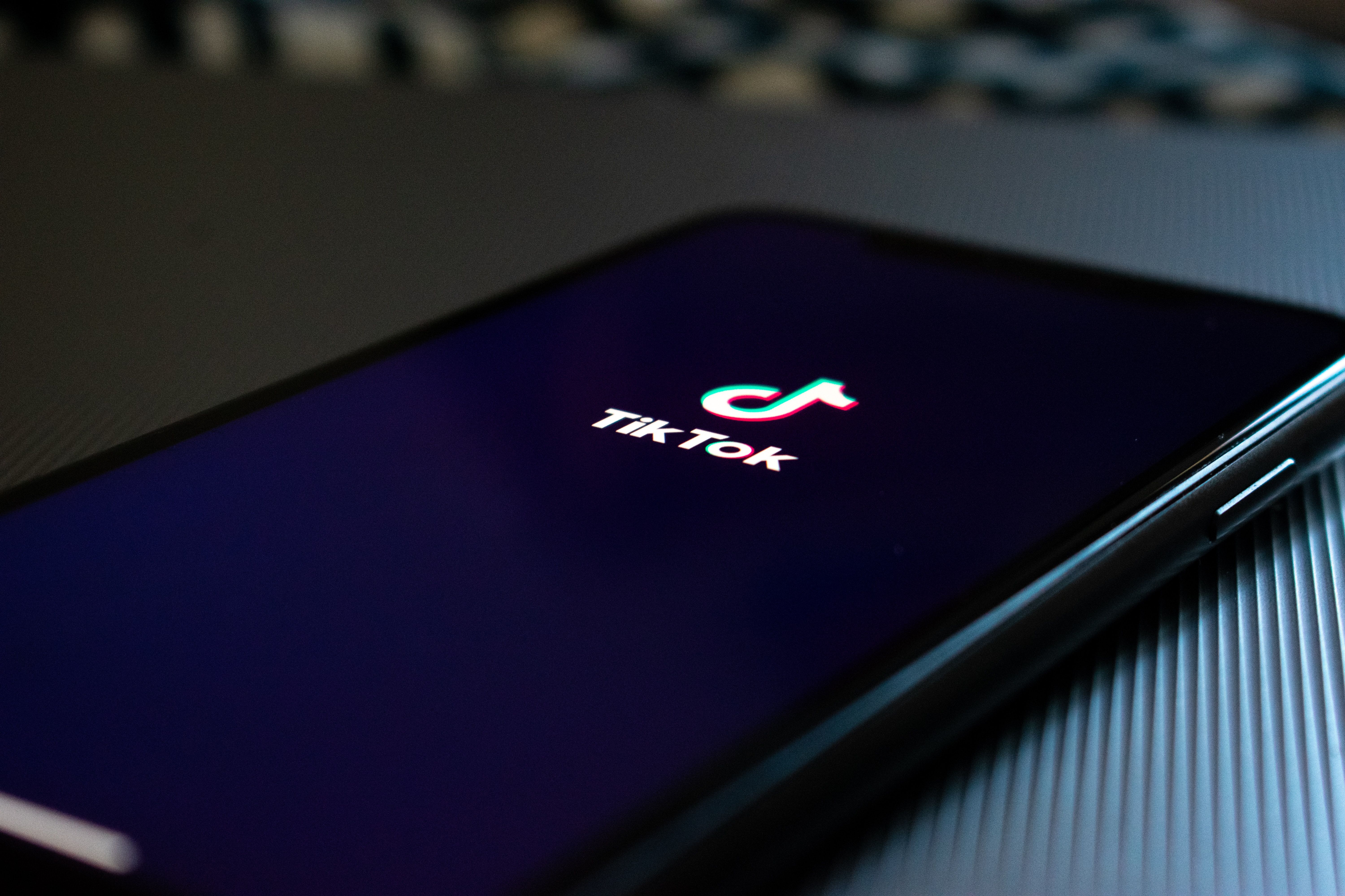 black smartphone displaying Tik Tok logo photo