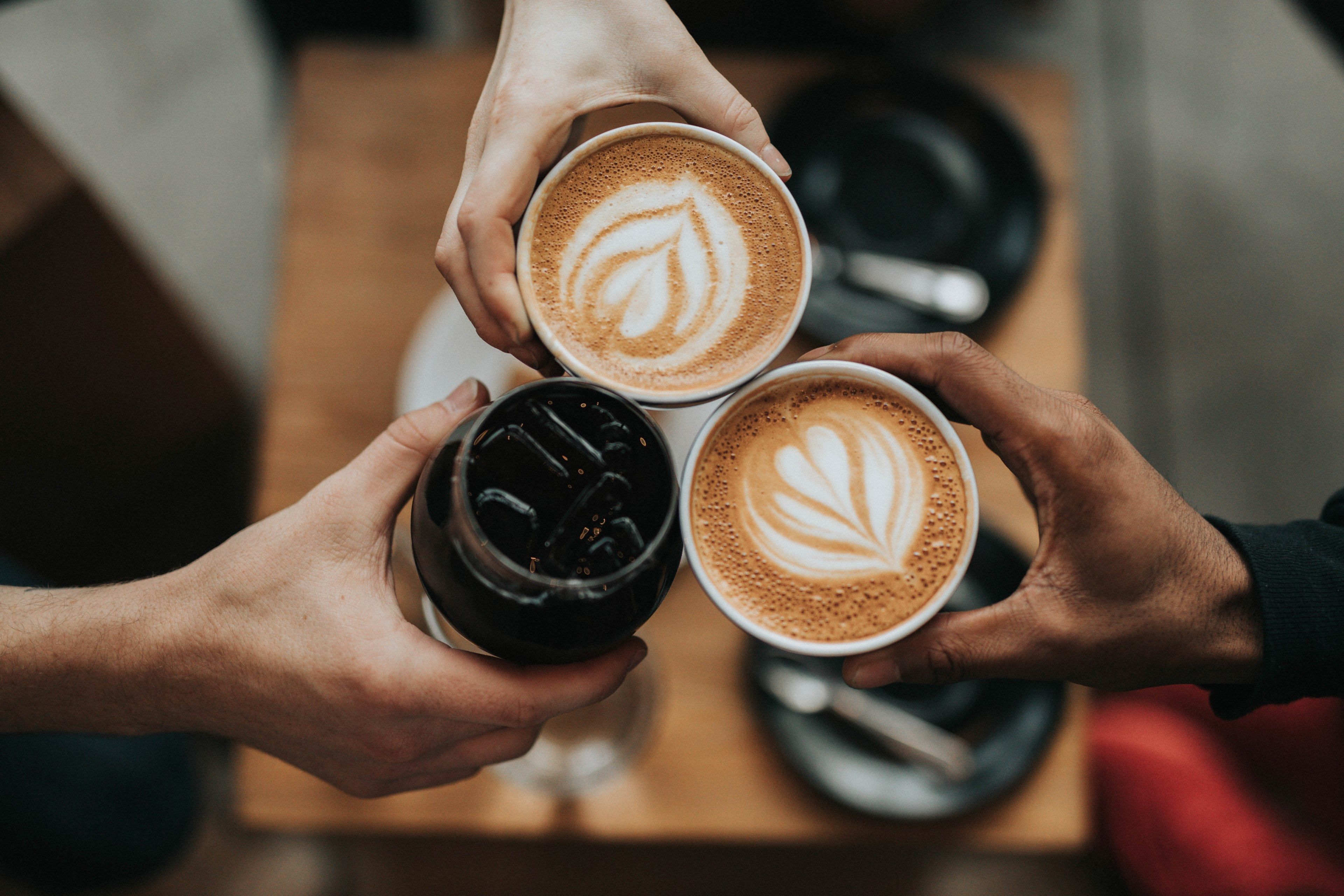 Wallpaper / three people cheering with iced coffee and lattes at verve coffee, coffee and friends 4k wallpaper