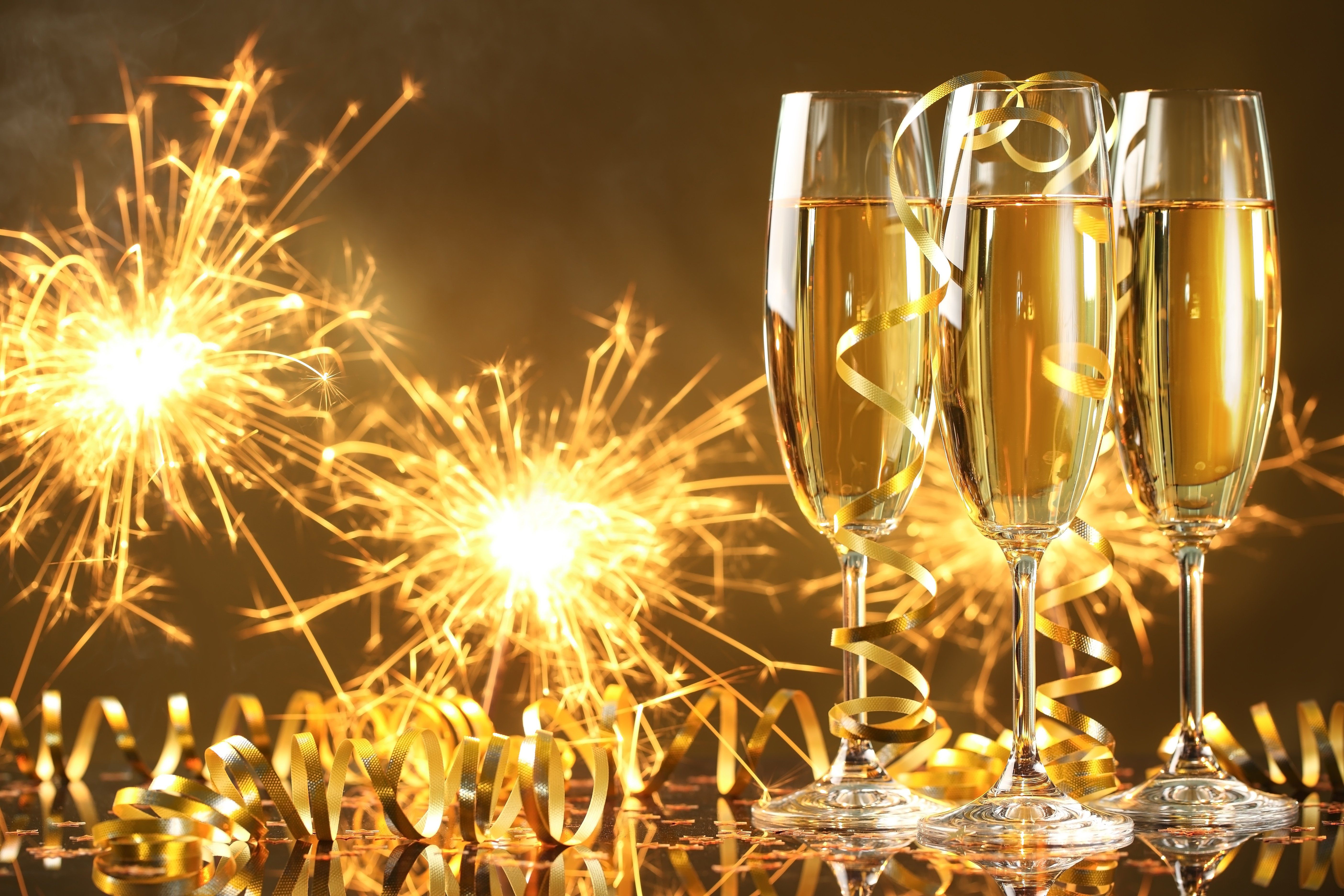 Happy New Year champagne golden celebration holiday New Year champagne glasses streamers sparklers wallpaperx3744