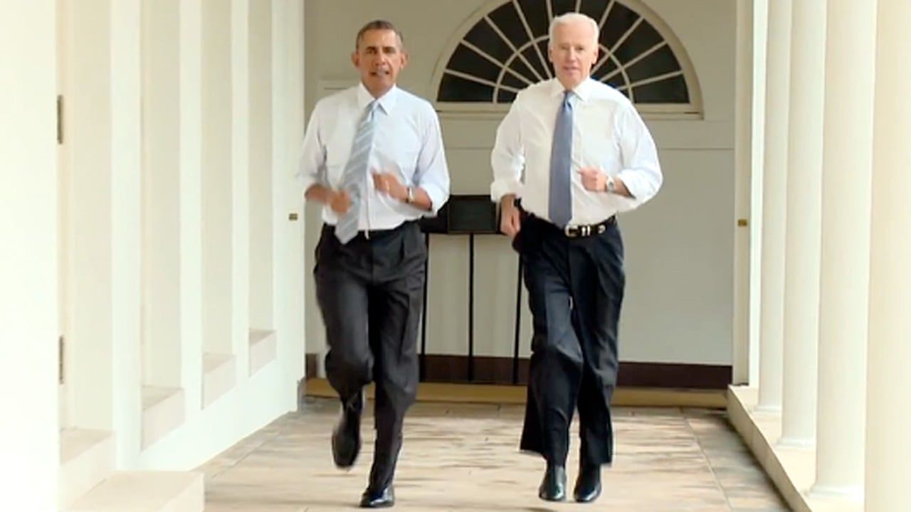 Barack Obama and Joe Biden jog through White House
