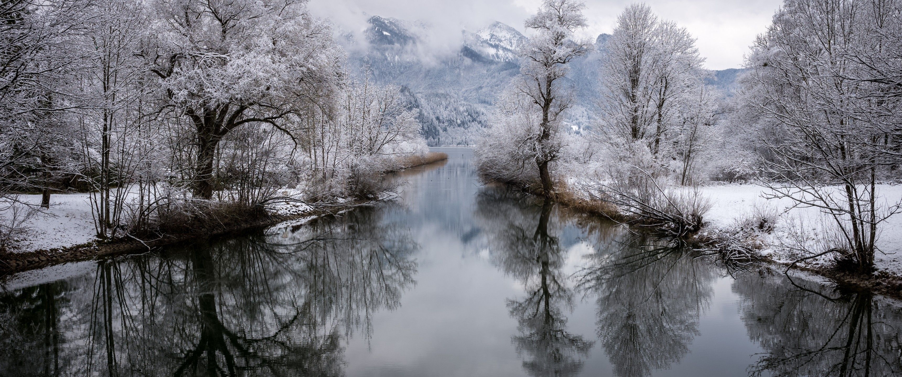 Download 3440x1440 River, Reflection, Snow, Trees, Winter, Mountain Wallpaper