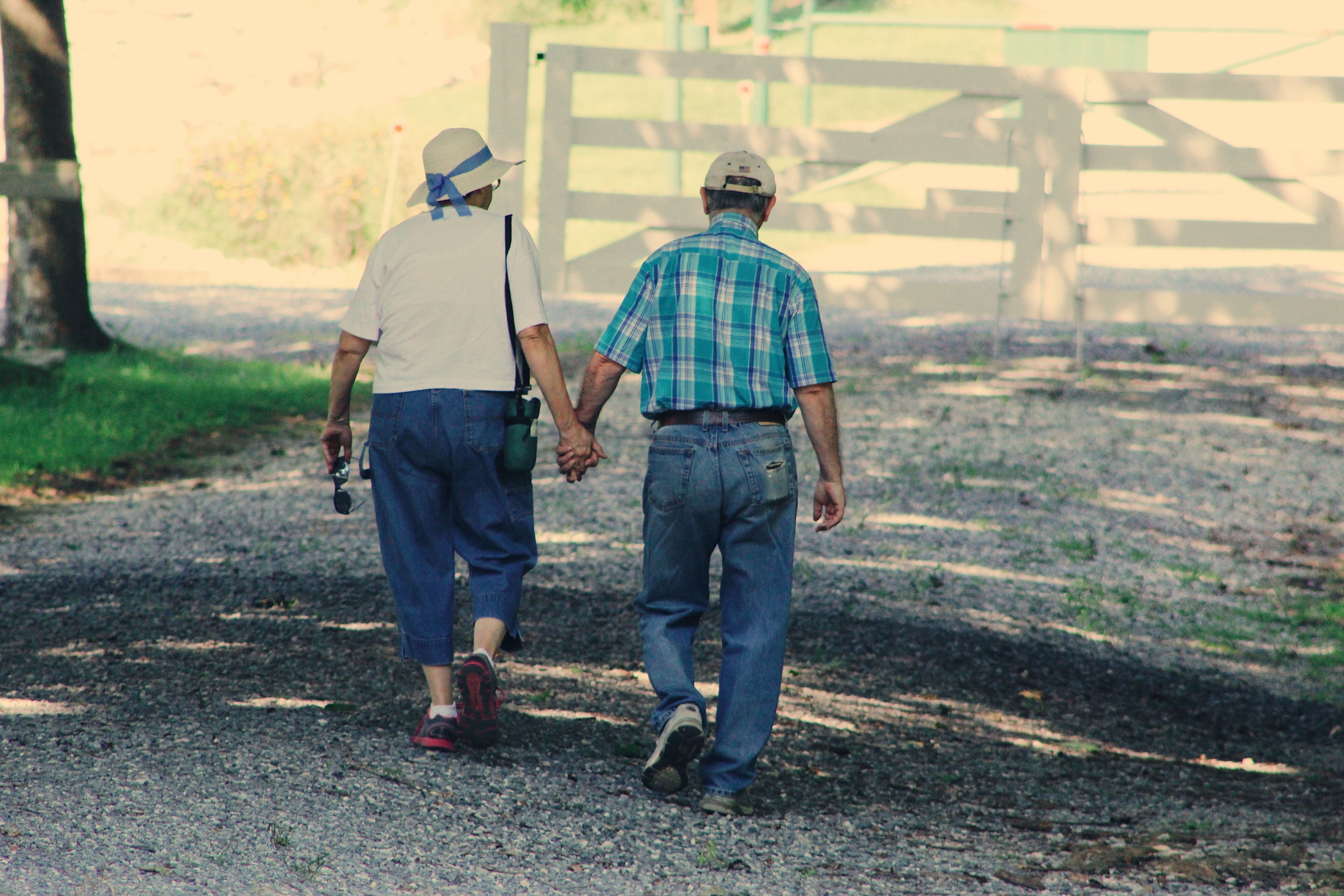 Old Couple Walking While Holding Hands · Free