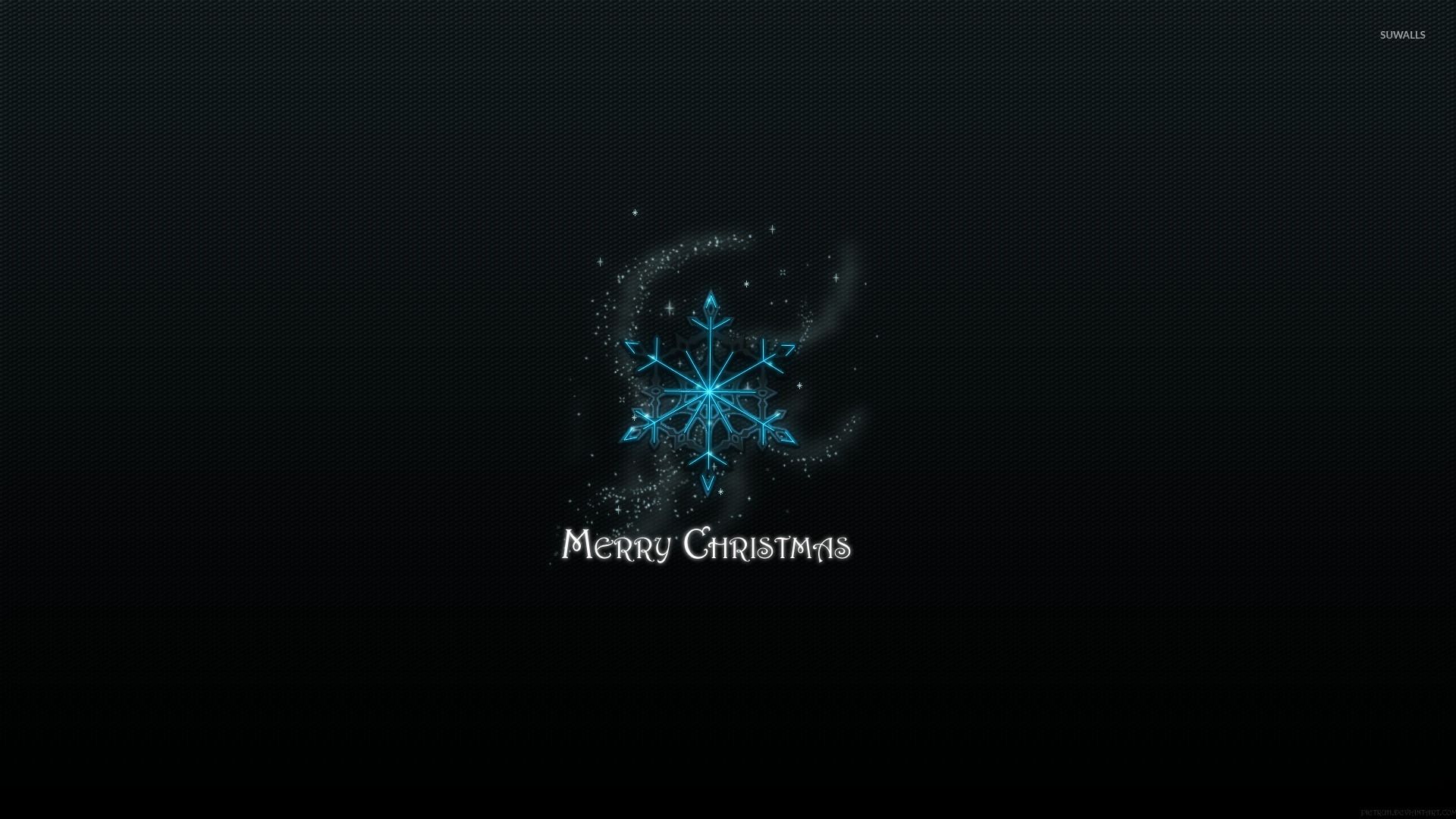Blue snowflake above the Merry Christmas sign wallpaper wallpaper
