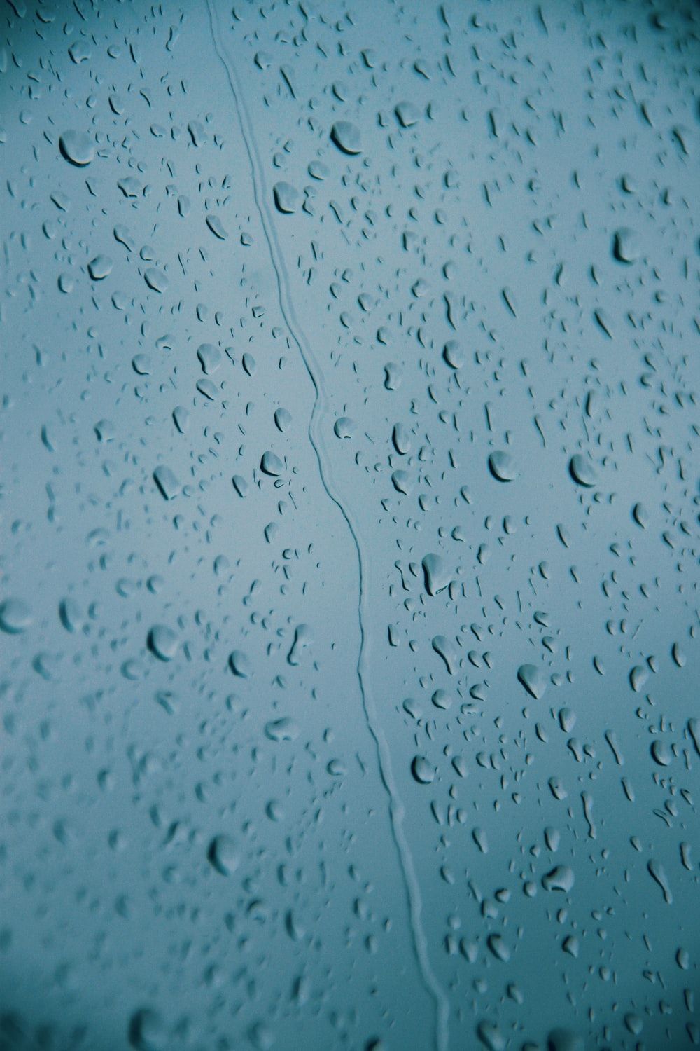 water drops on glass panel photo