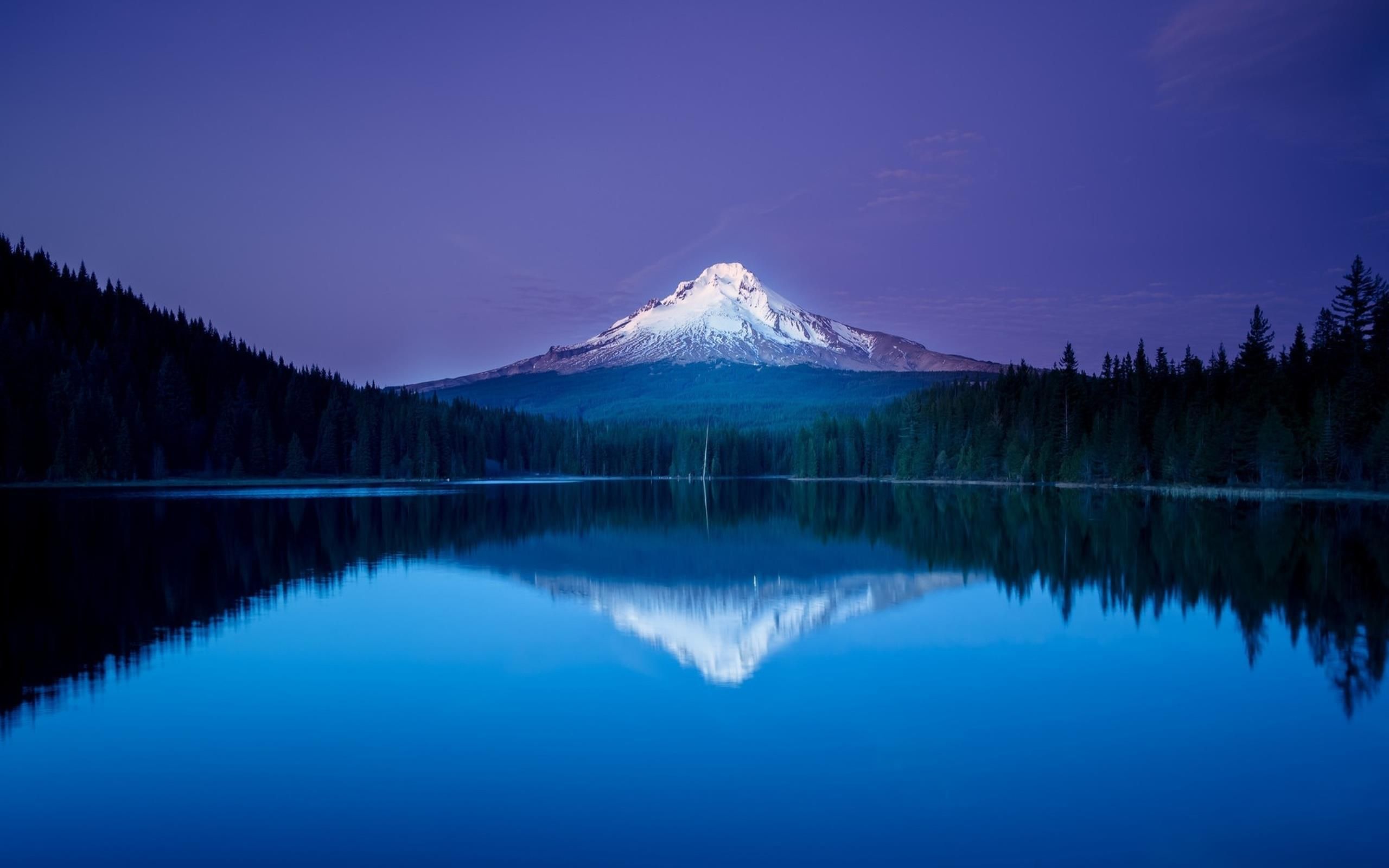 Perfect reflection of the mountains in the clear lake