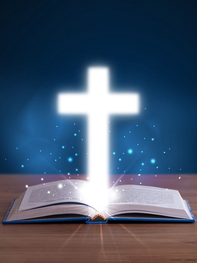 Opened Bible With Light Cross