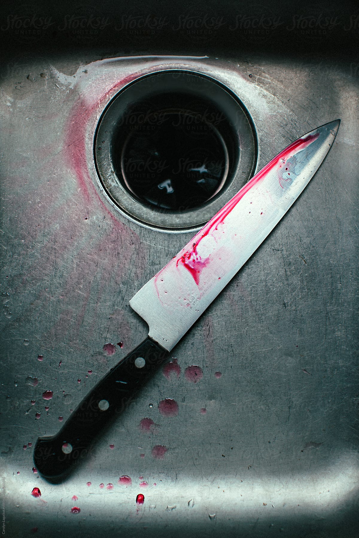 Bloody knife in the sink
