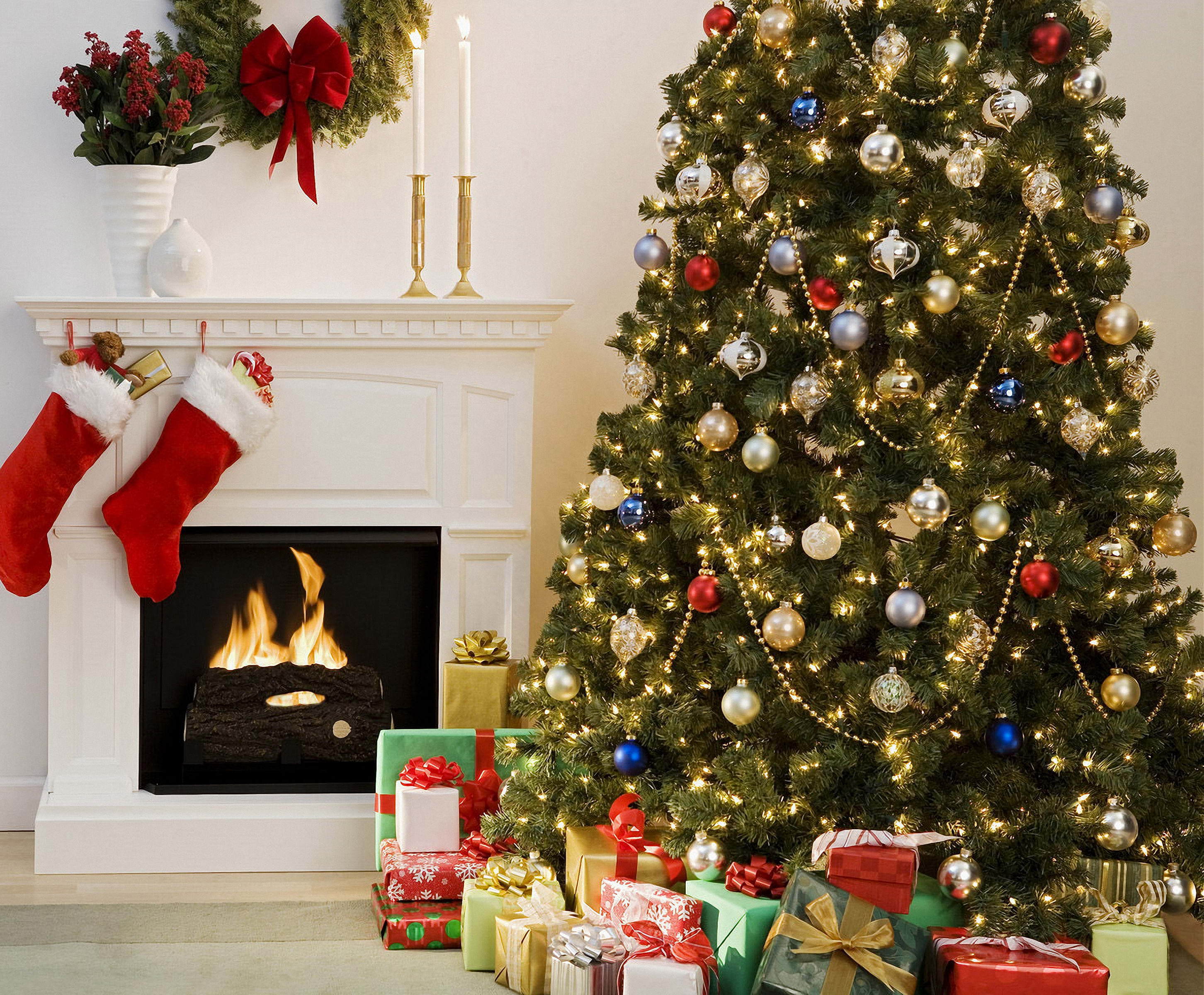 Christmas tree with presents by the fireplace wallpaper and image, picture, photo