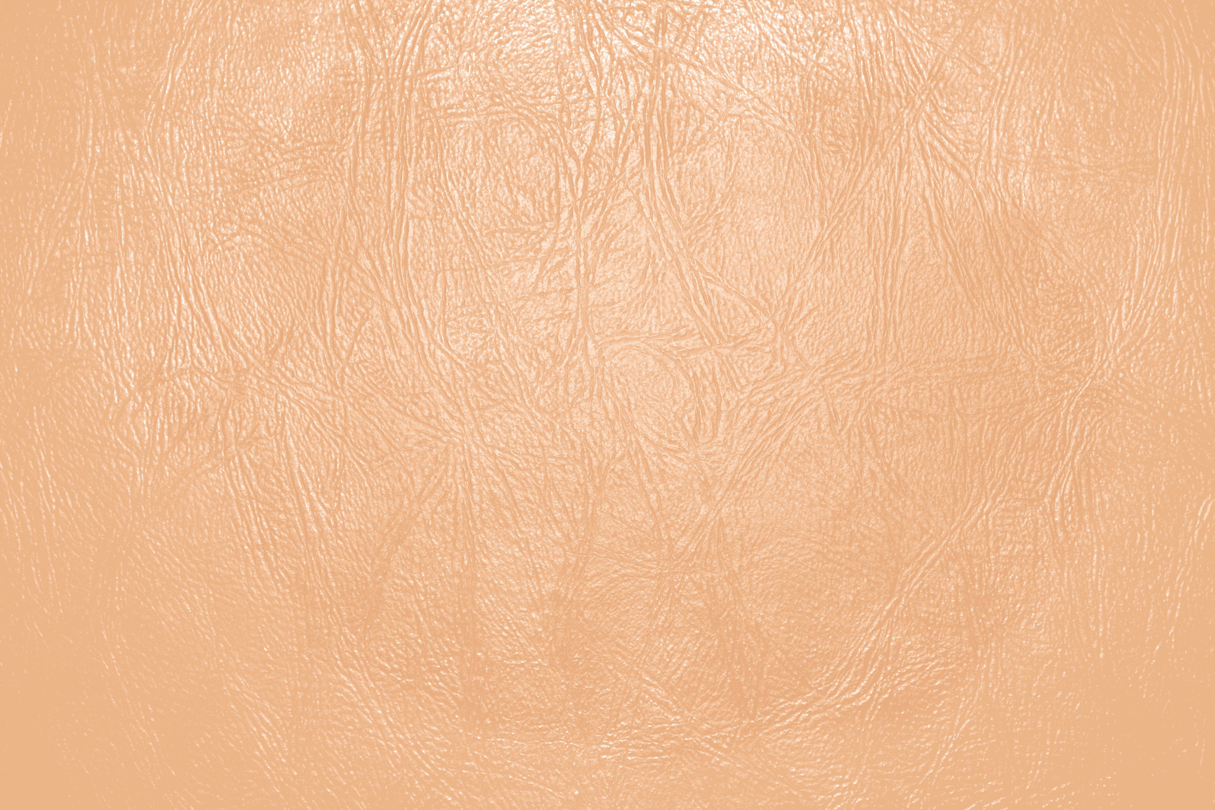 Light Orange or Peach Colored Leather Close Up Texture Picture