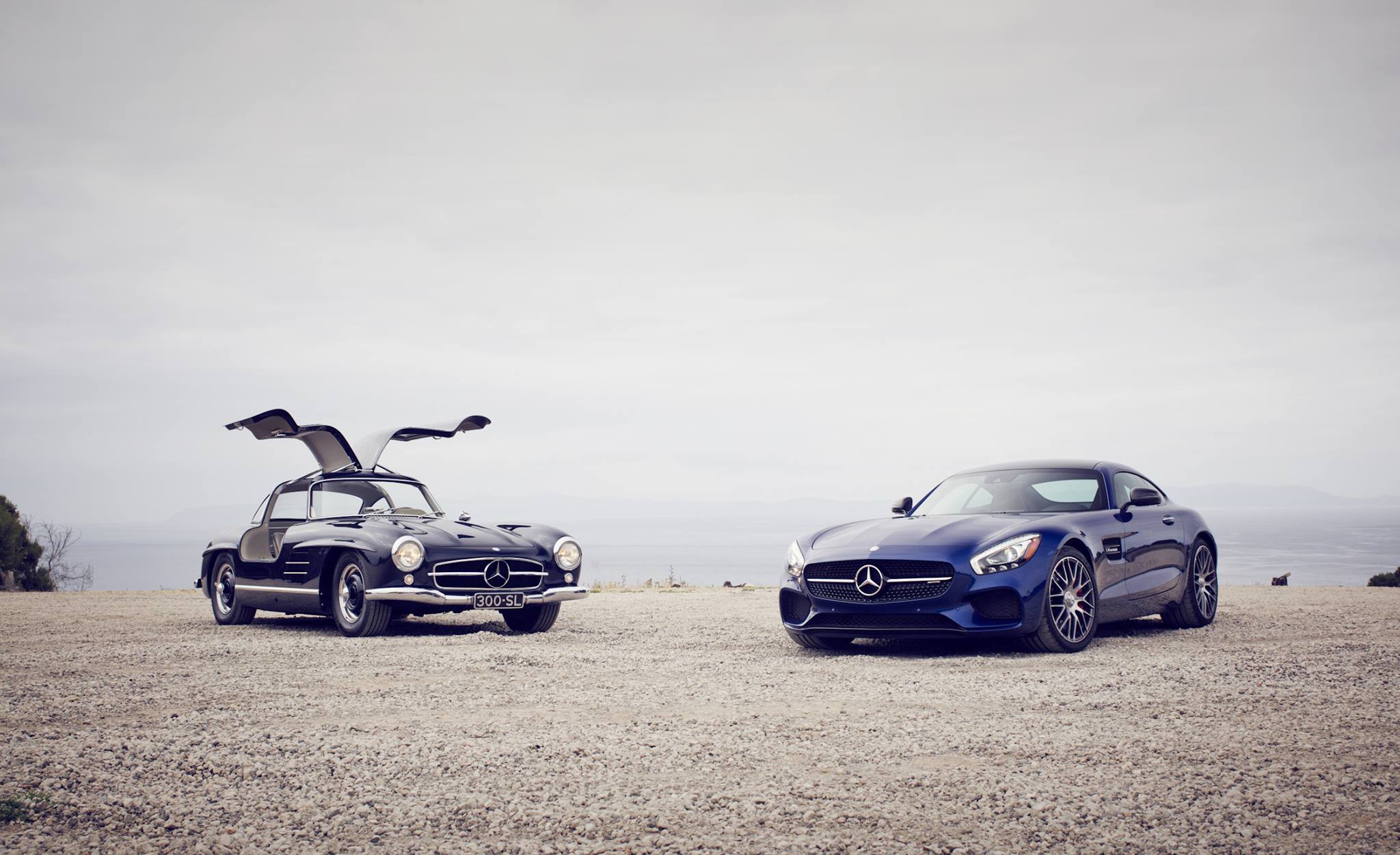 GermanBoost Mercedes wallpaper features the classic Gullwing 300 SL and the new C197 AMG GT S