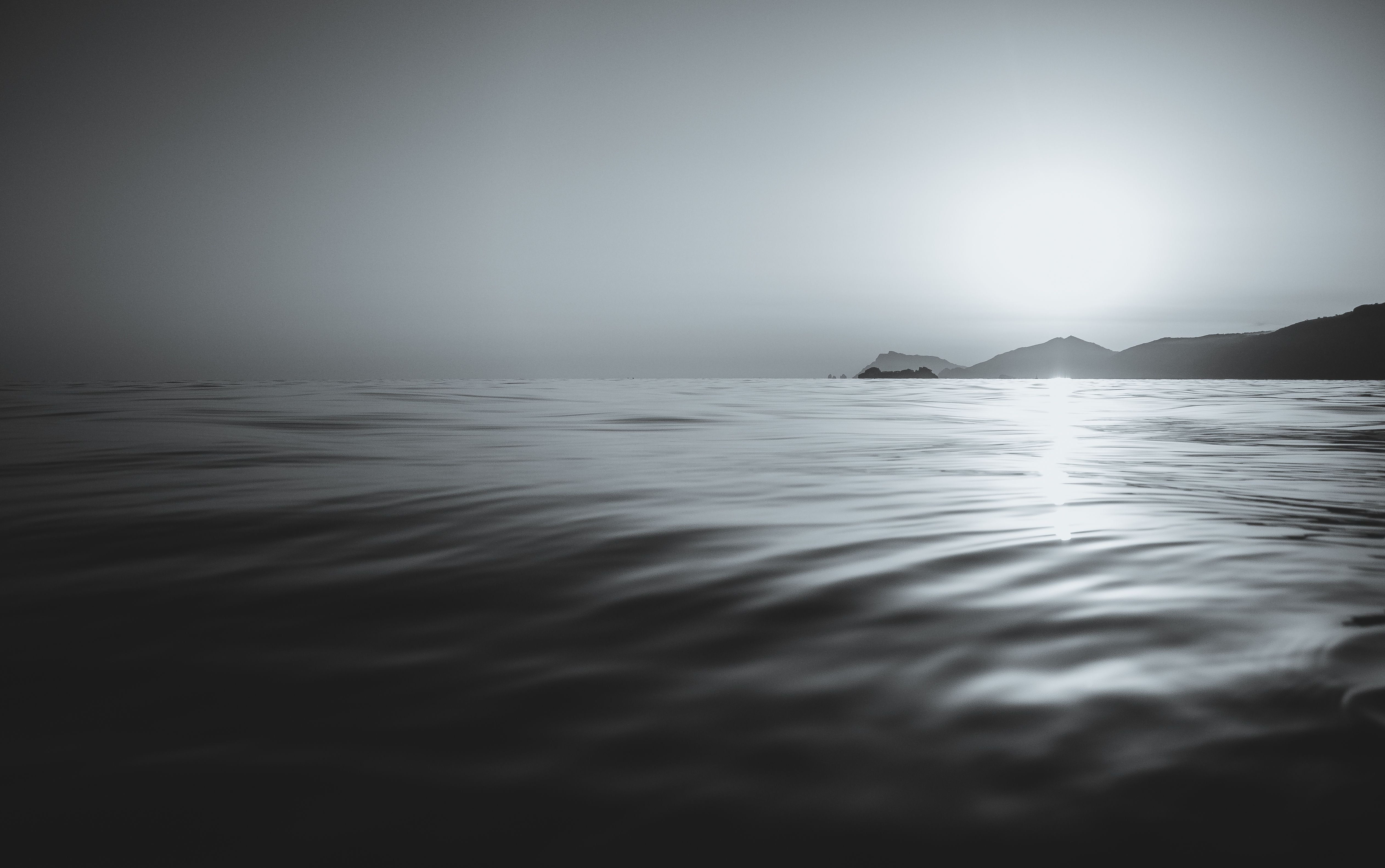 Black and white Calm Coast Islands Sea Sunset Waves 4K wallpaper