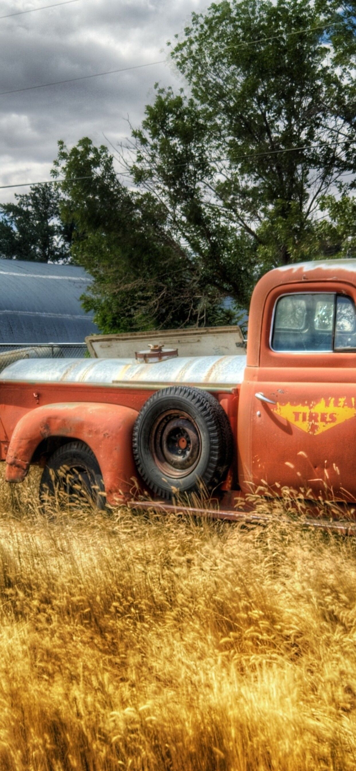 Old red truck in the wheat field