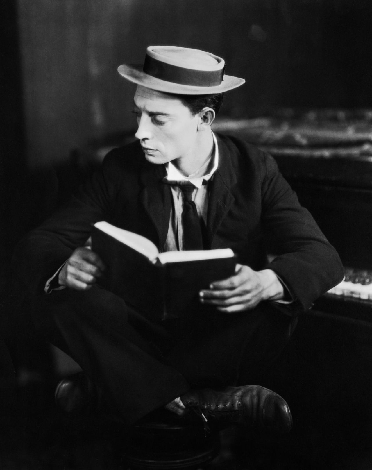 Buster Keaton reading. When, at six months, he tumbled down a flight of stairs unharmed, he was given the name “Buster” by Harry. Silent movie, Comedians, Actors