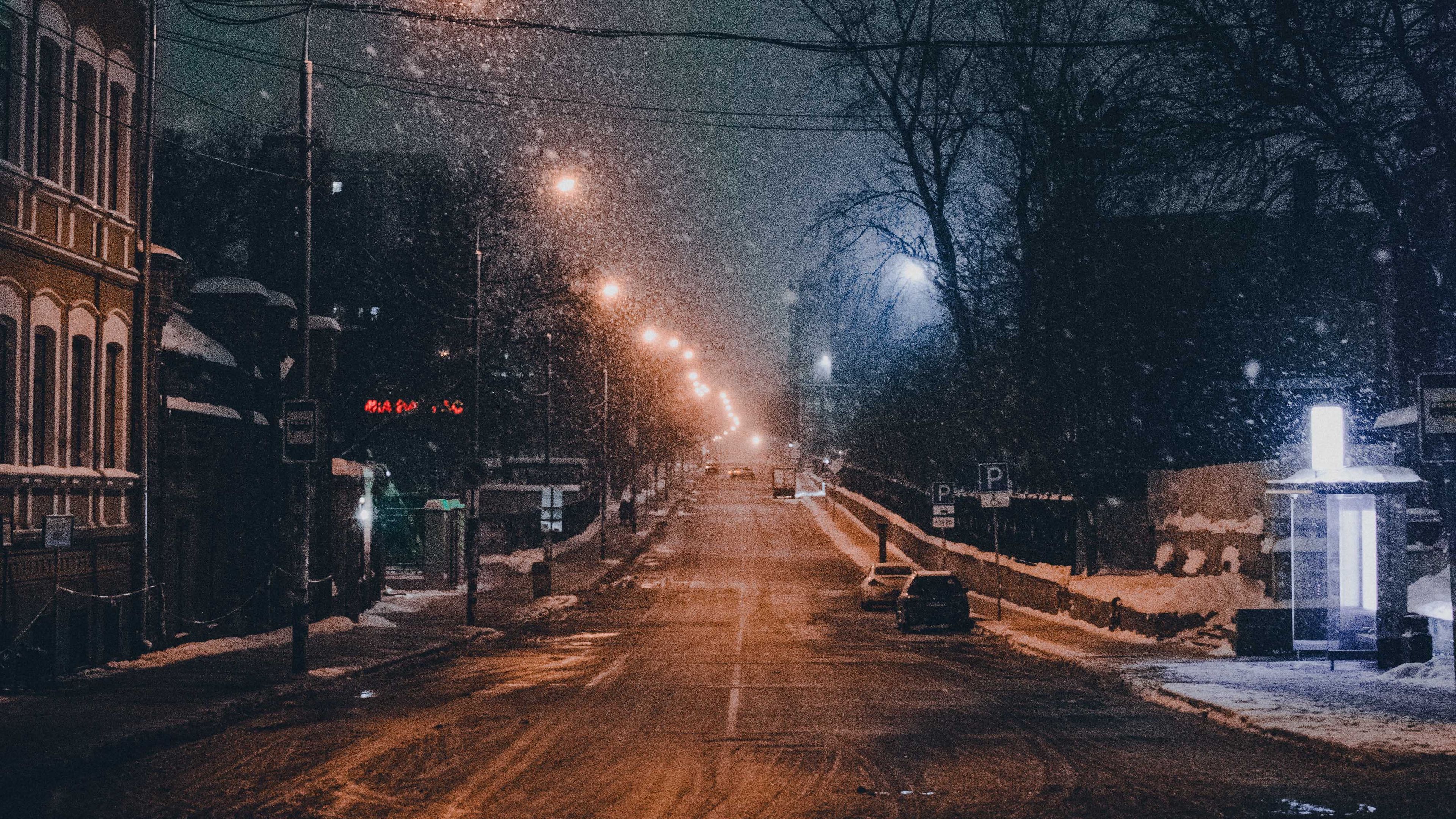 Download wallpapers 3840x2160 night city, road, snowfall, winter, twilight 4k uhd 16:9 hd backgrounds