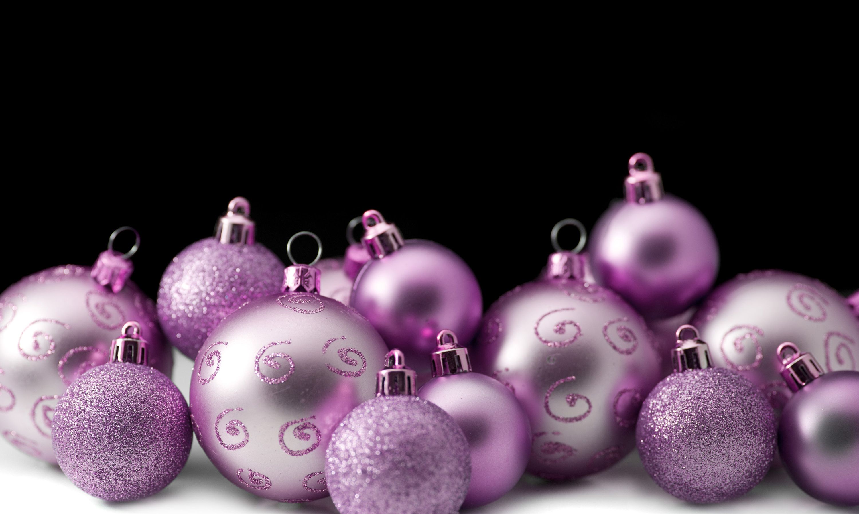Photo of purple and pink christmas ornaments