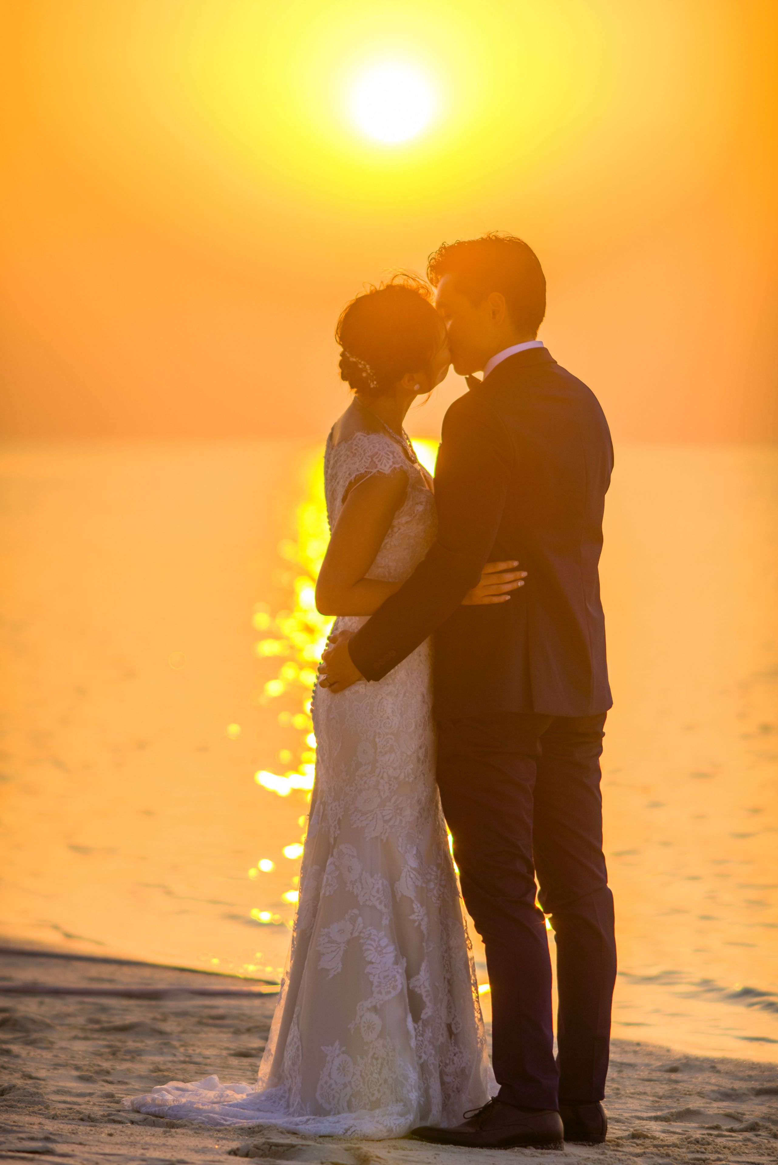 Man and Woman Kissing Under Sunset · Free