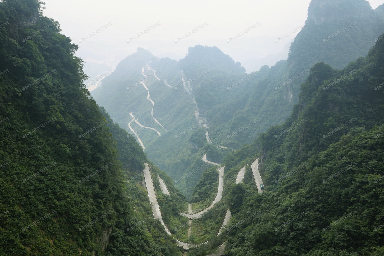 View of winding road of Tianmen mountain national park photo by estivillml on Envato Elements