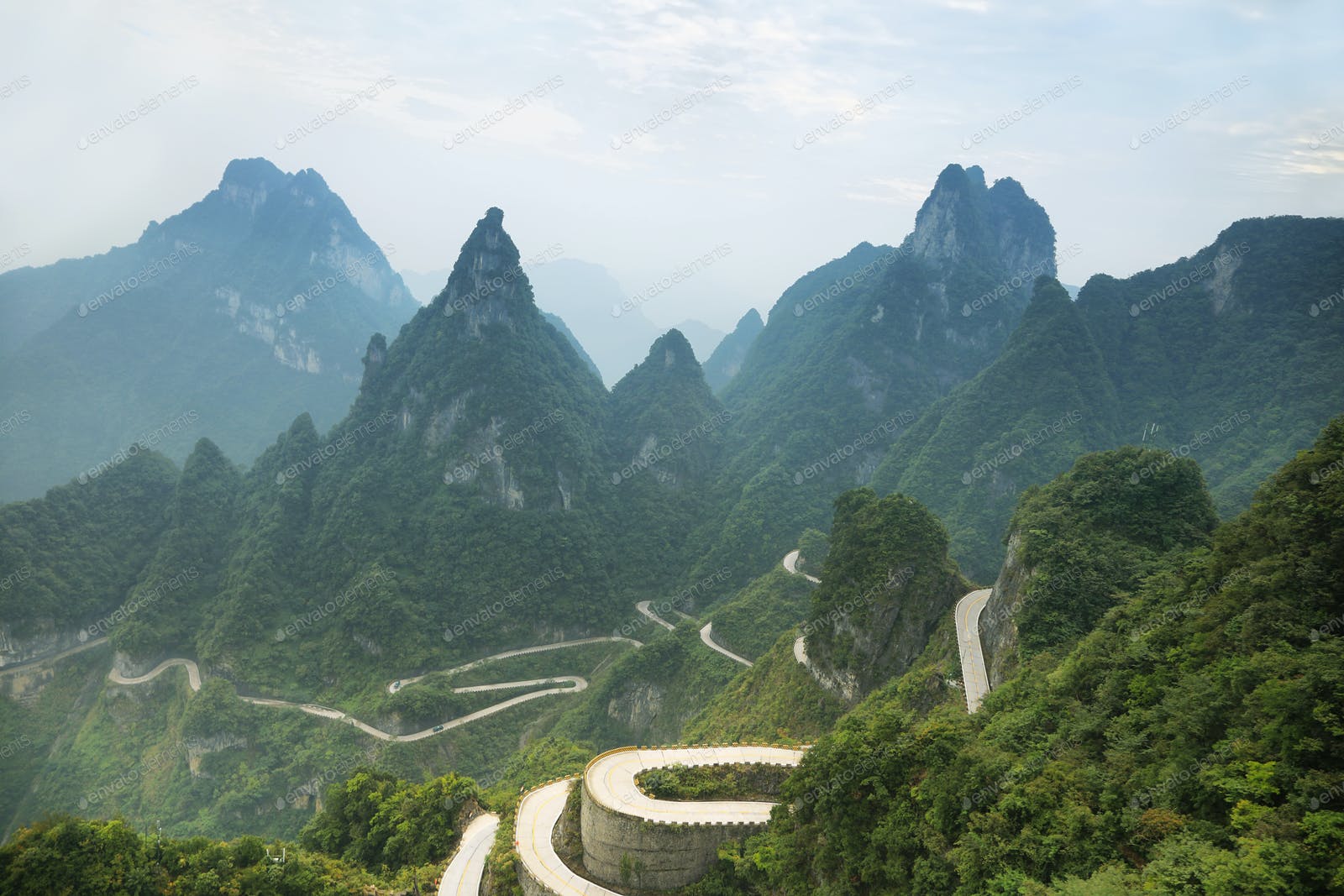 View of winding road of Tianmen mountain national park photo by estivillml on Envato Elements