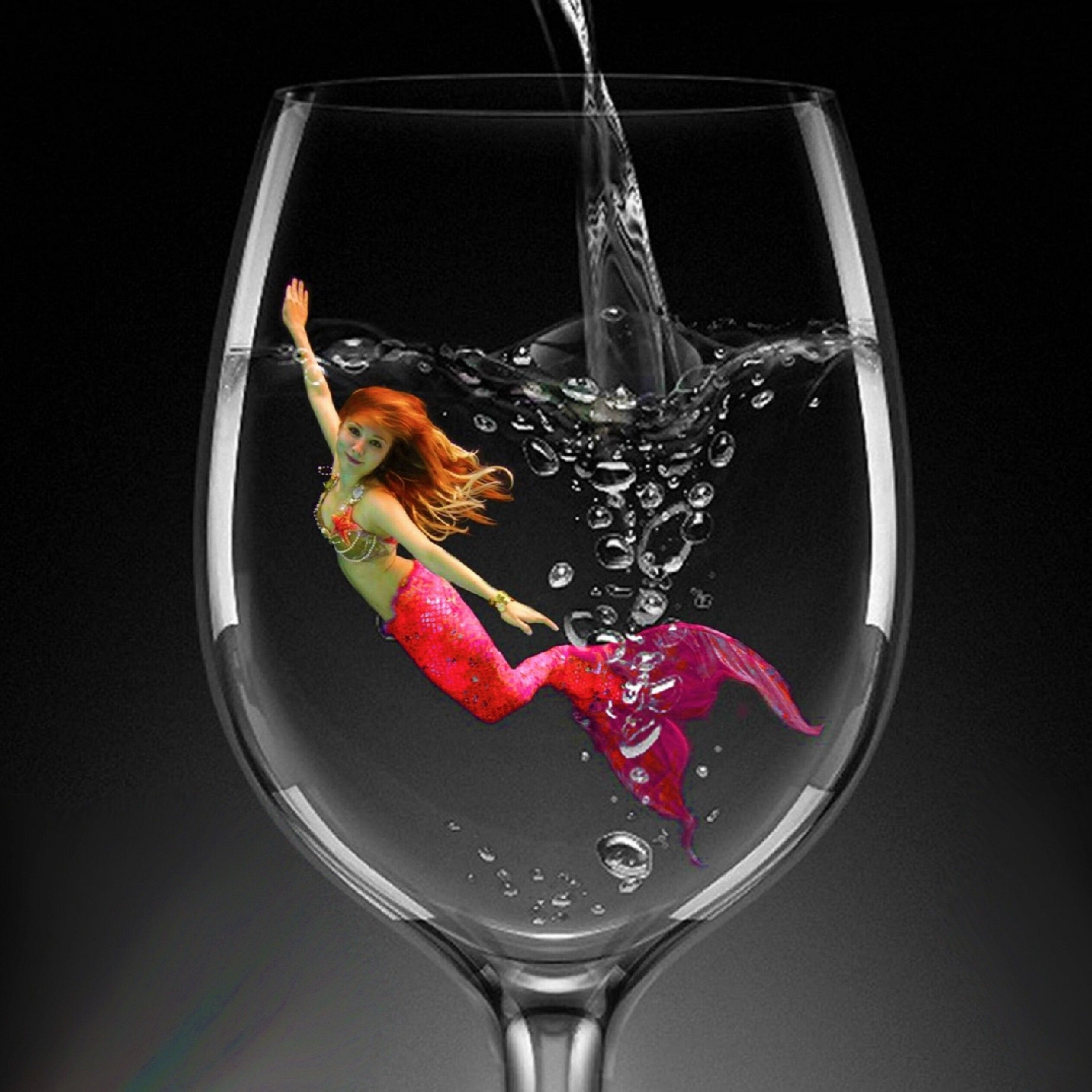 Red Mermaid in a glass of water
