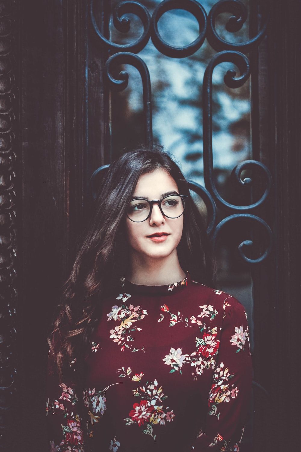 woman with eyeglasses and red dress photo