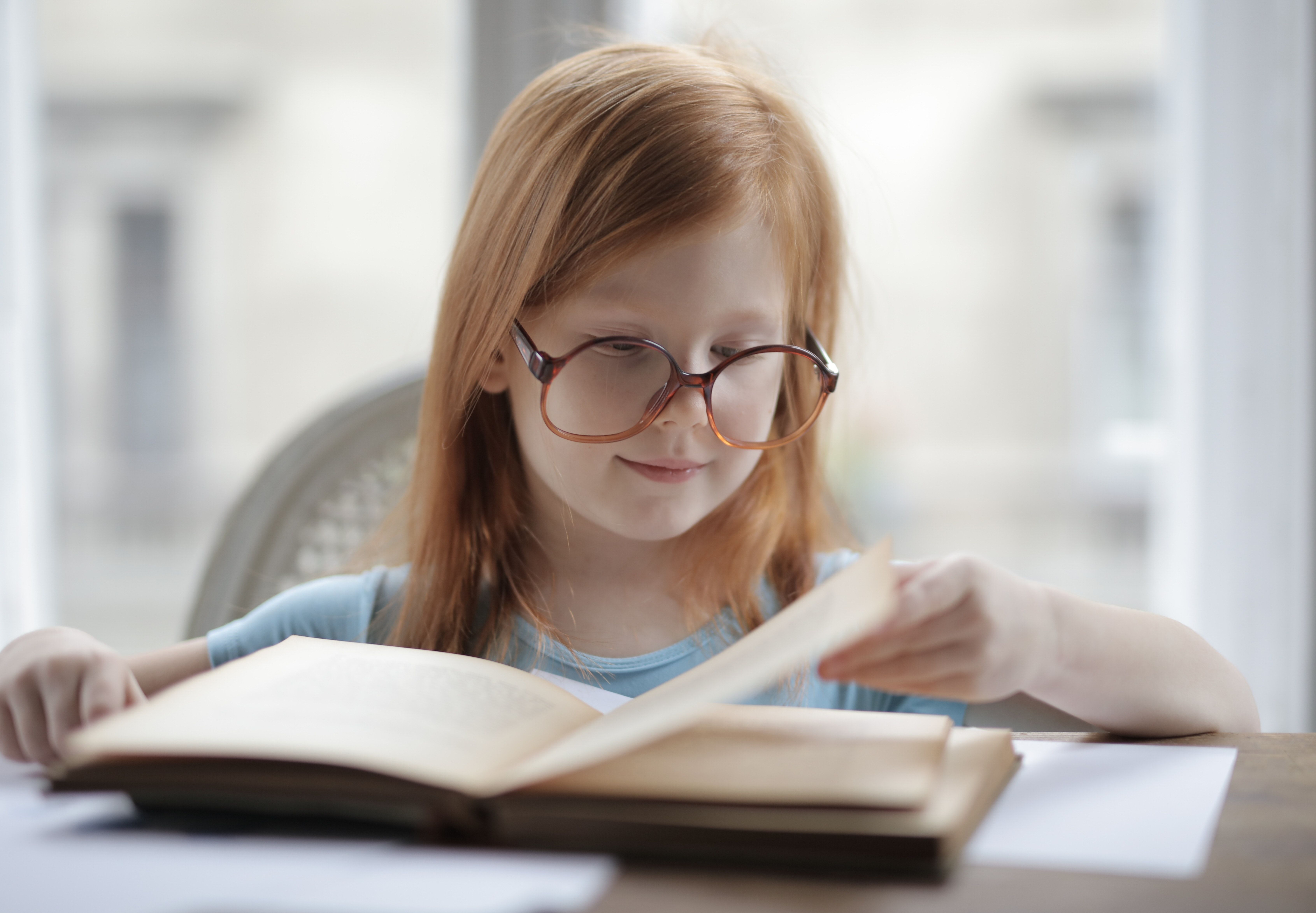 Girl Reading A Book With Eyeglasses · Free